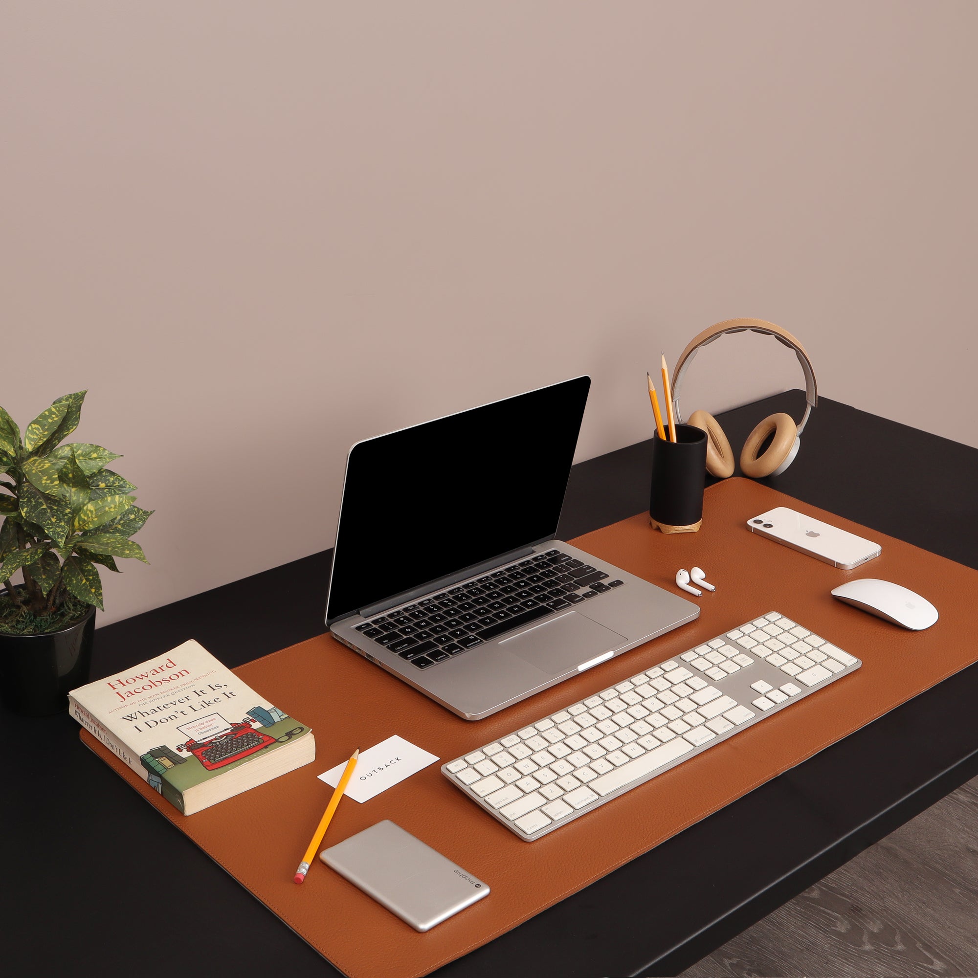 A luxurious desk mat made from premium full grain leather, featuring a smooth surface and burnished edges, perfect for enhancing any workspace.