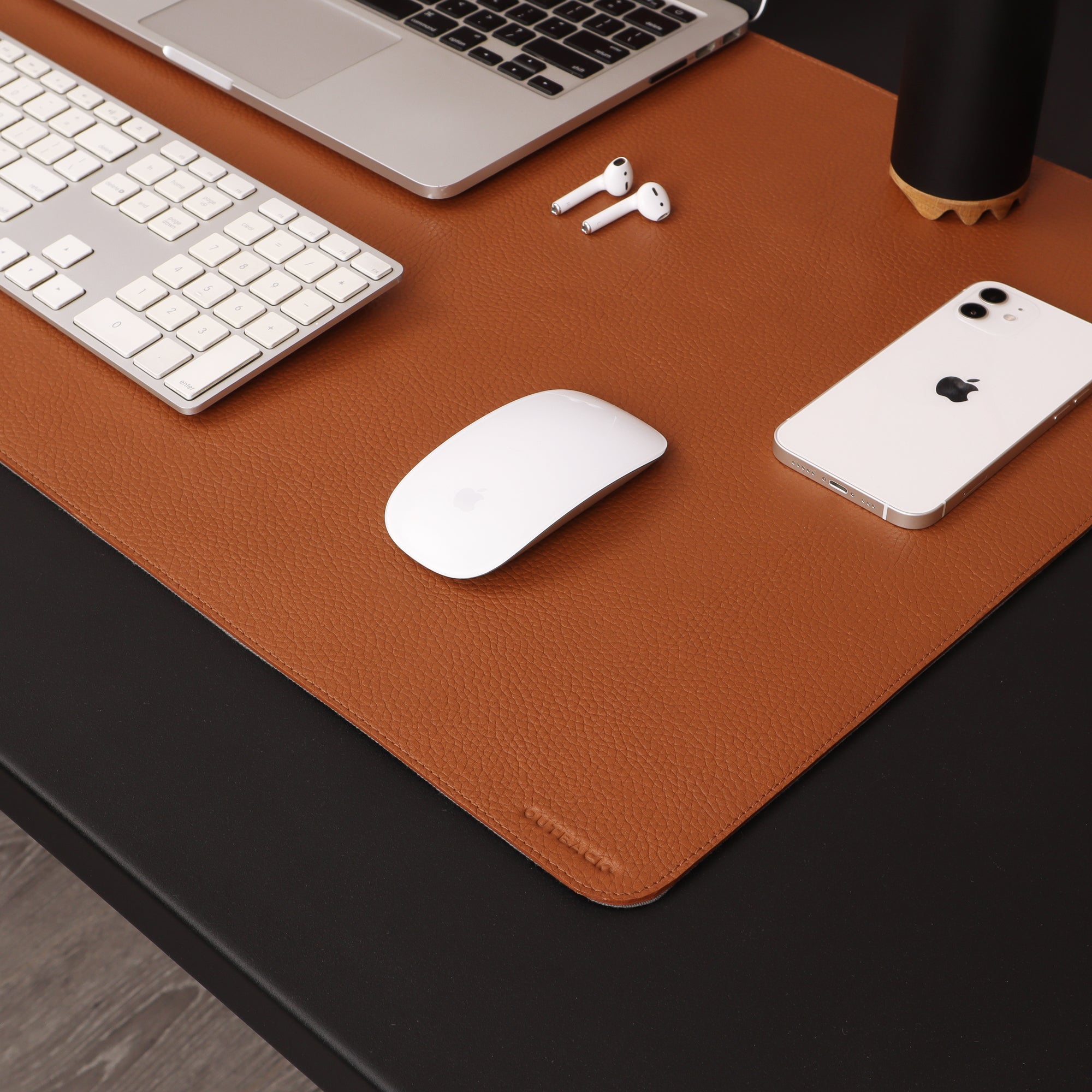 A luxurious desk mat made from premium full grain leather, featuring a smooth surface and burnished edges, perfect for enhancing any workspace.