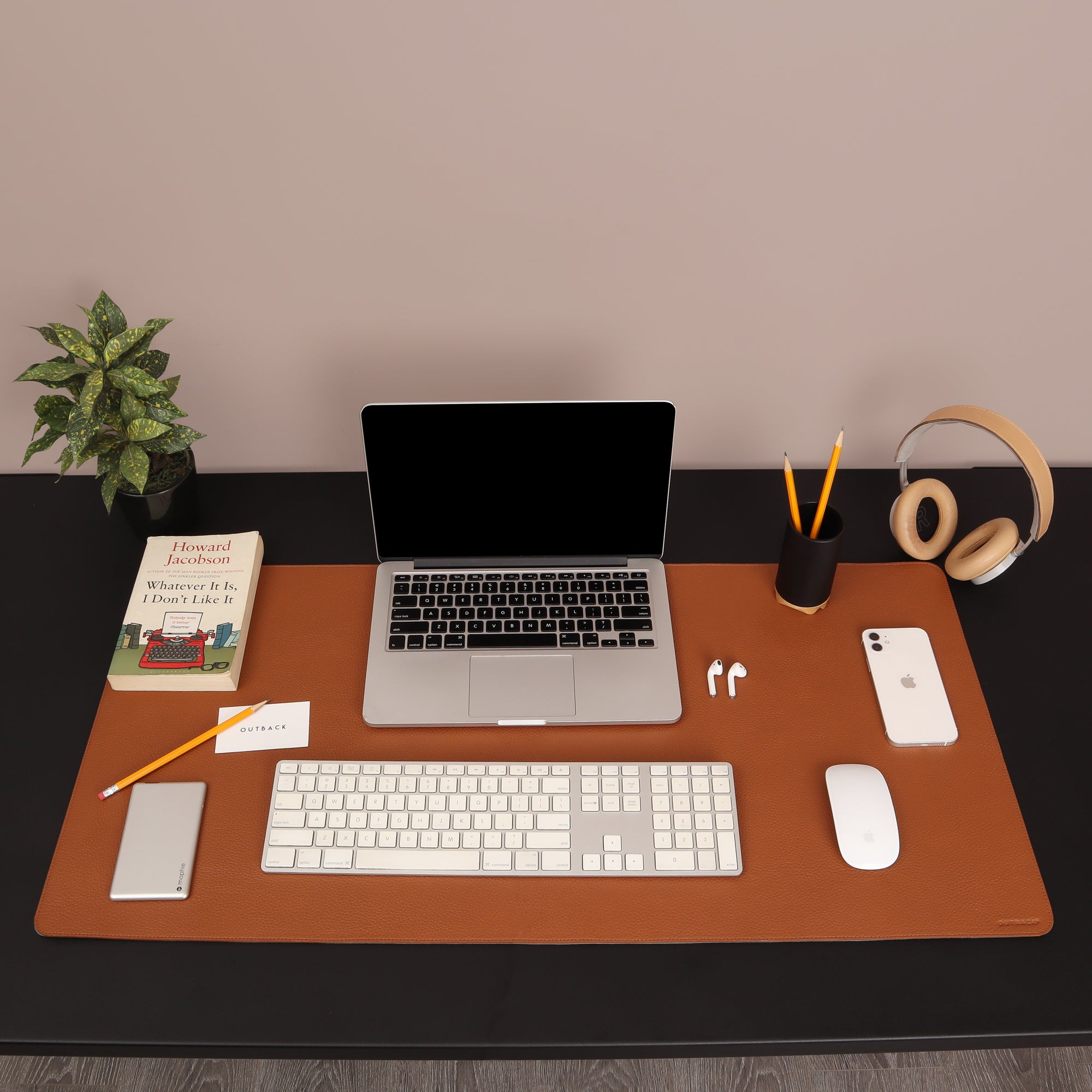 A luxurious desk mat made from premium full grain leather, featuring a smooth surface and burnished edges, perfect for enhancing any workspace.