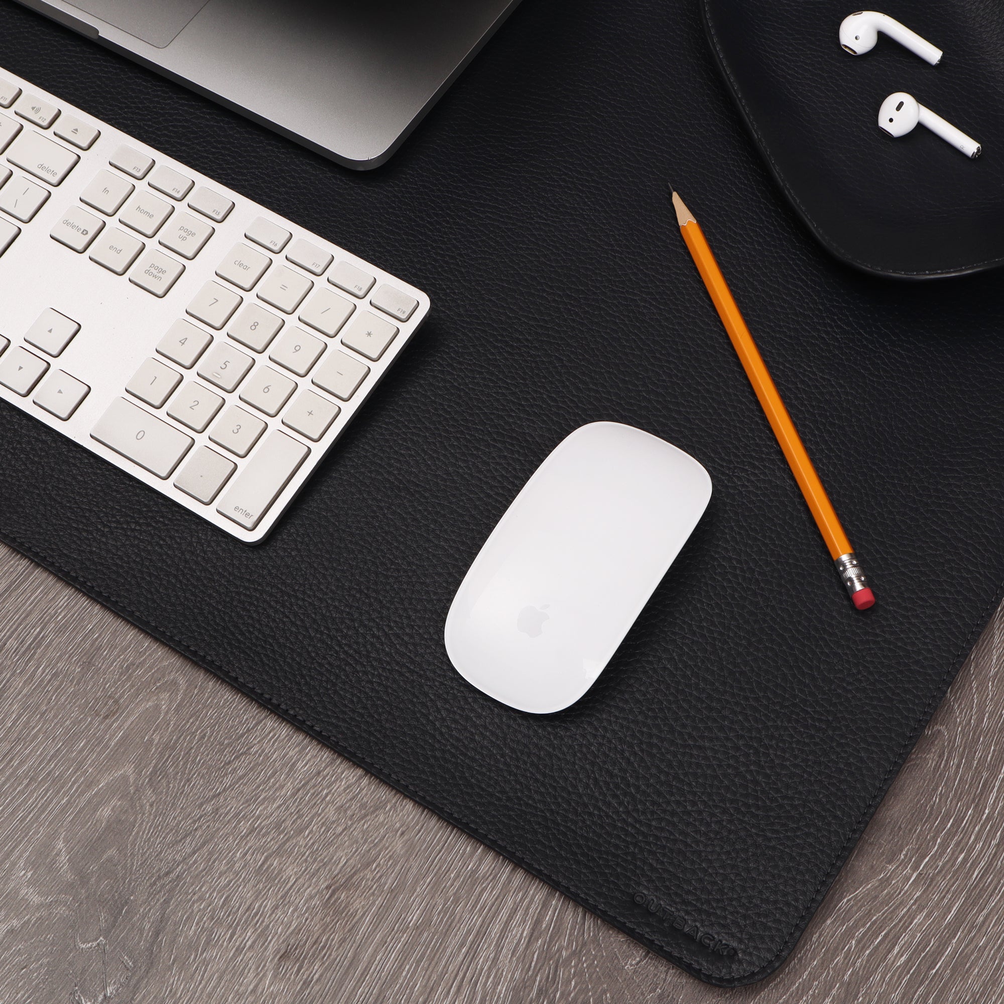 A luxurious desk mat made from premium full grain leather, featuring a smooth surface and elegant design, perfect for enhancing any workspace.