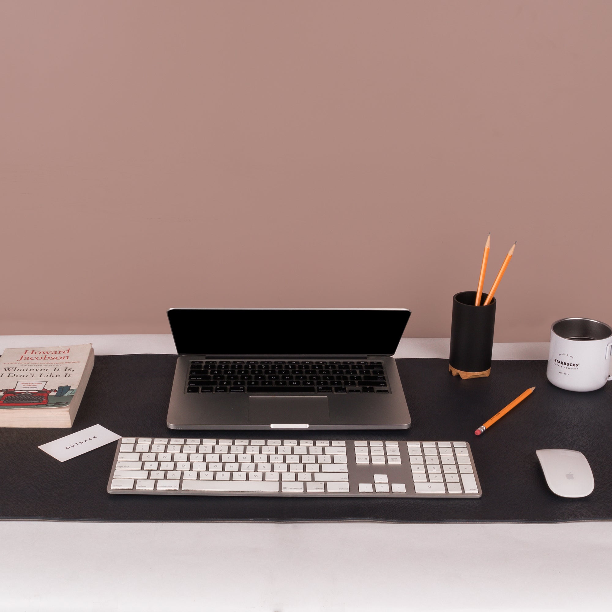 A luxurious desk mat made from premium full grain leather, featuring a smooth surface and burnished edges, perfect for enhancing any workspace.