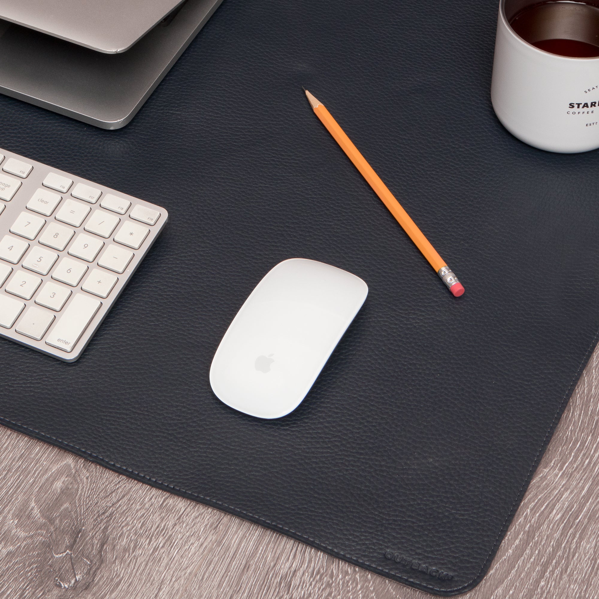 A luxurious desk mat made from premium full grain leather, featuring a smooth surface and burnished edges, perfect for enhancing any workspace.