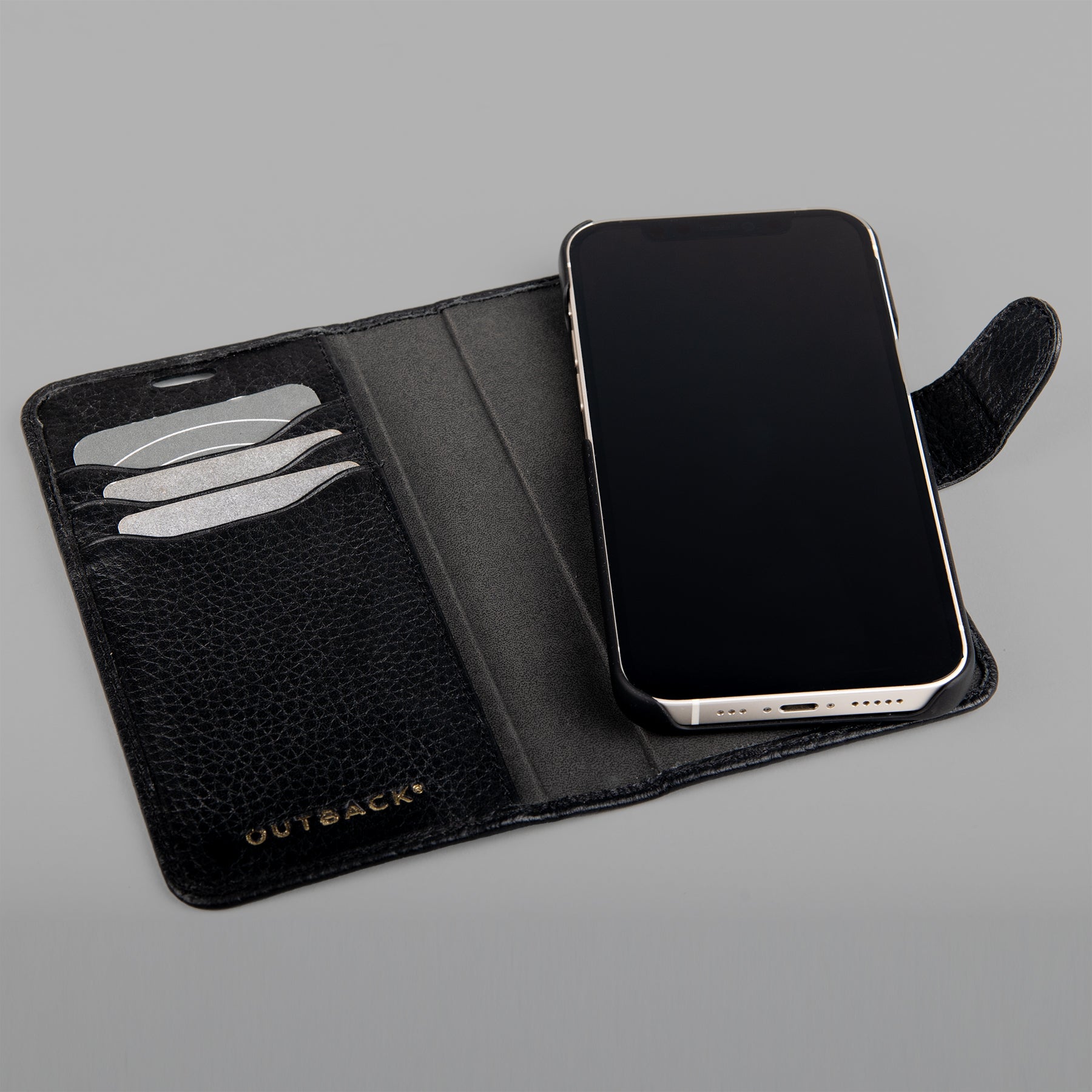 Detachable iPhone Case made from premium full-grain leather with credit card slots and currency pocket, showcasing its sleek design and antique brass hardware.