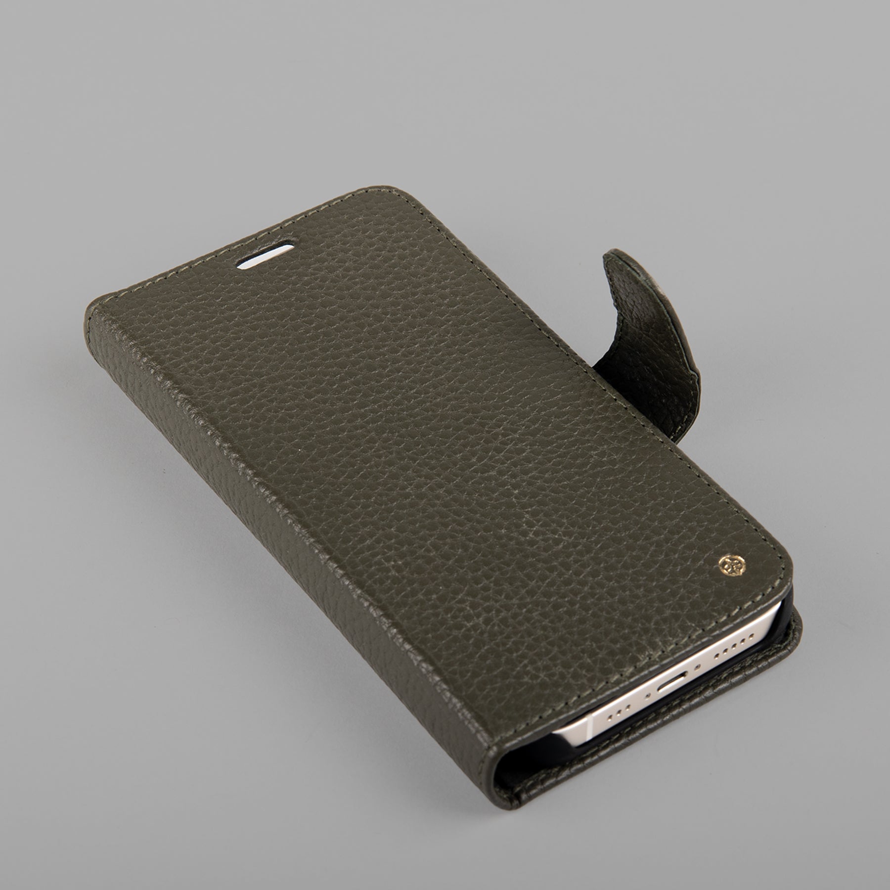 A stylish detachable iPhone case made of premium full-grain leather, featuring credit card slots and a currency pocket, showcasing its sleek design.