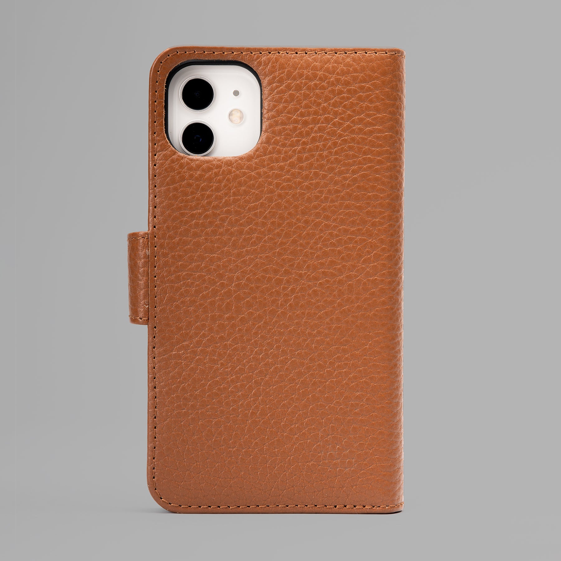 Detachable iPhone Case made from premium full-grain leather, featuring credit card slots and a currency pocket, showcasing its sleek design.