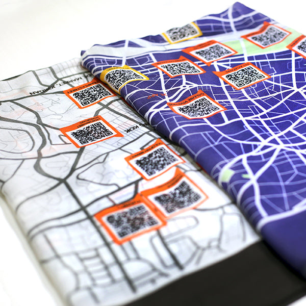 Discarvery map scarf featuring a unique map design with QR codes for travel inspiration and experiences.