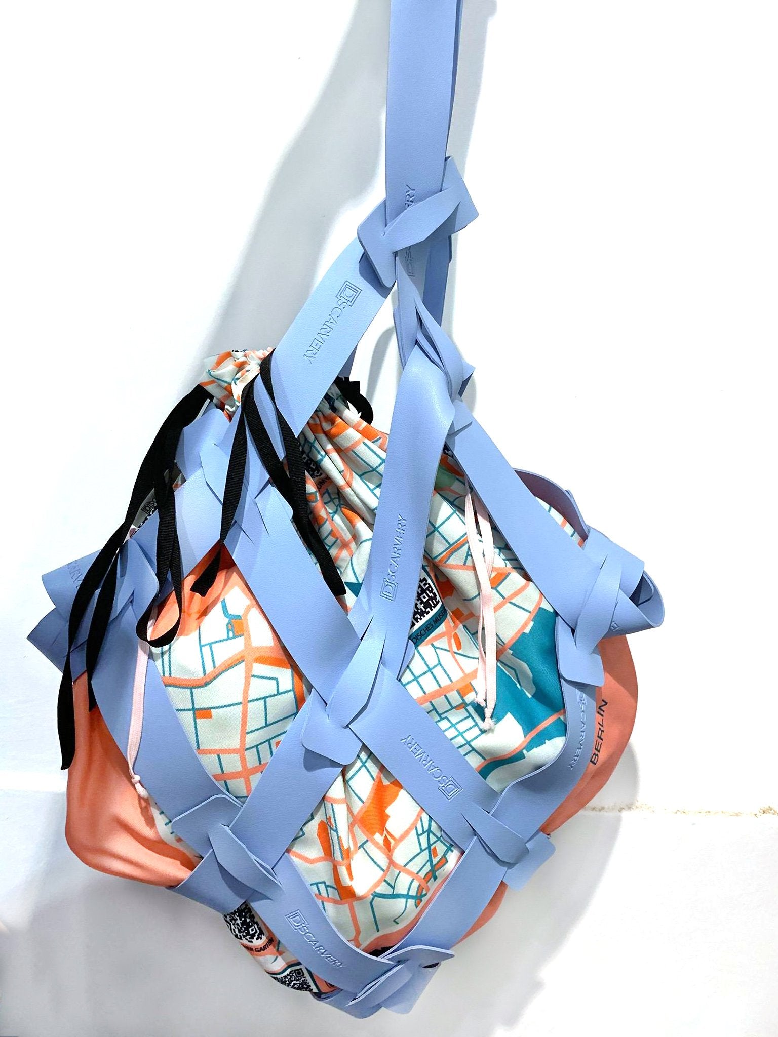 DiSCARVERY Tall Hashtag Weave Bag featuring double-face weave straps and detachable drawstring bag in a stylish design.