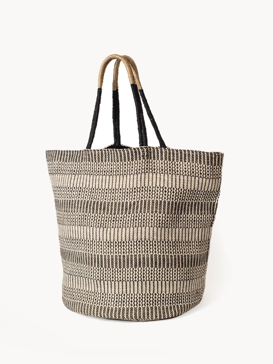 Dobi Shoulder Tote in Black, featuring a spacious round bottom and stylish handle, handcrafted from jute-cotton fabric.