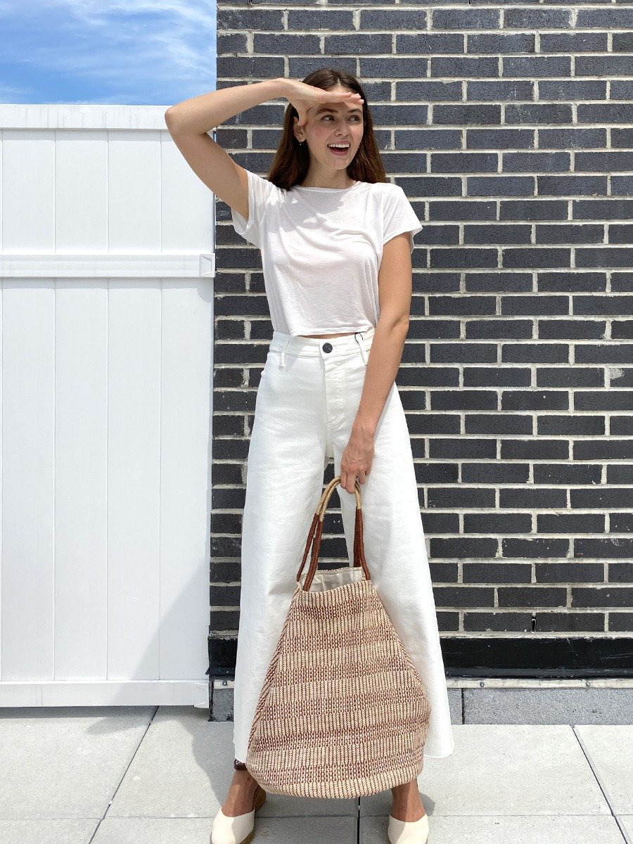 Dobi Shoulder Tote in Brown, featuring a spacious design and round bottom, handmade from jute-cotton fabric with off-white handle accents.