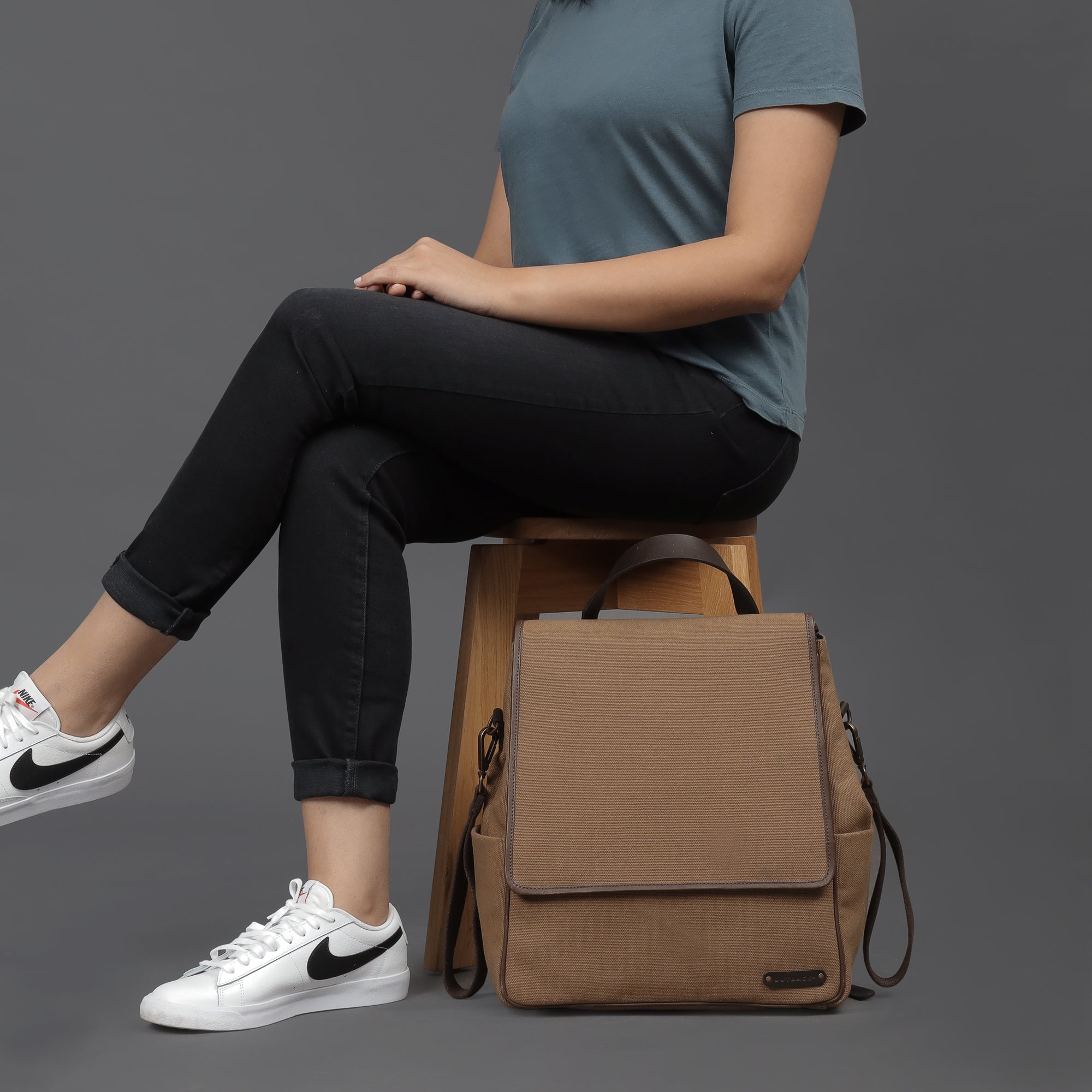 Stylish Donna Canvas Diaper Bag in durable cotton canvas with multiple pockets and leather straps, perfect for parents on the go.