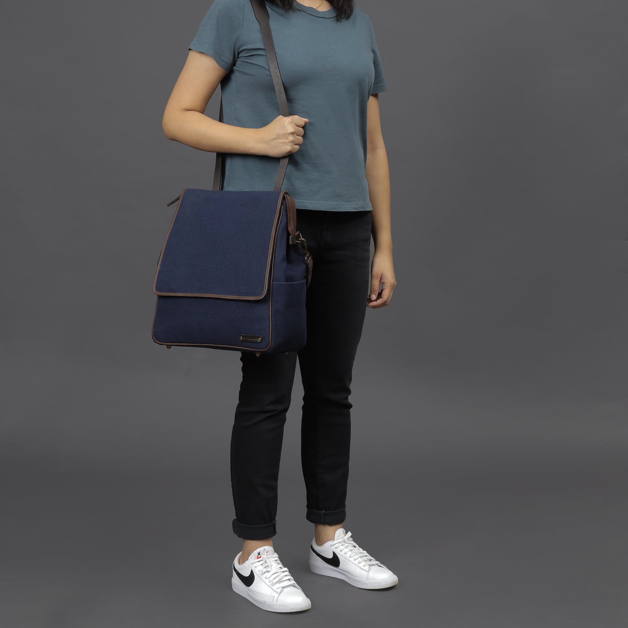 Stylish Donna Canvas Diaper Bag in durable cotton canvas with multiple pockets and leather straps, perfect for parents on the go.