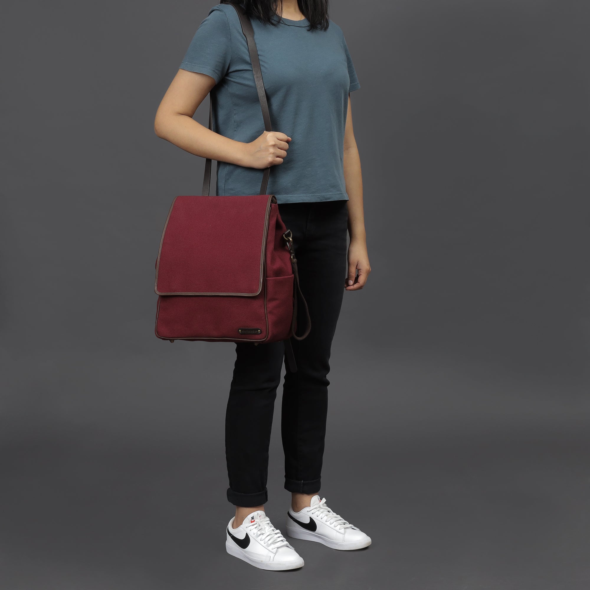 Donna Canvas Diaper Bag in stylish design with multiple pockets and durable materials, perfect for parents on the go.