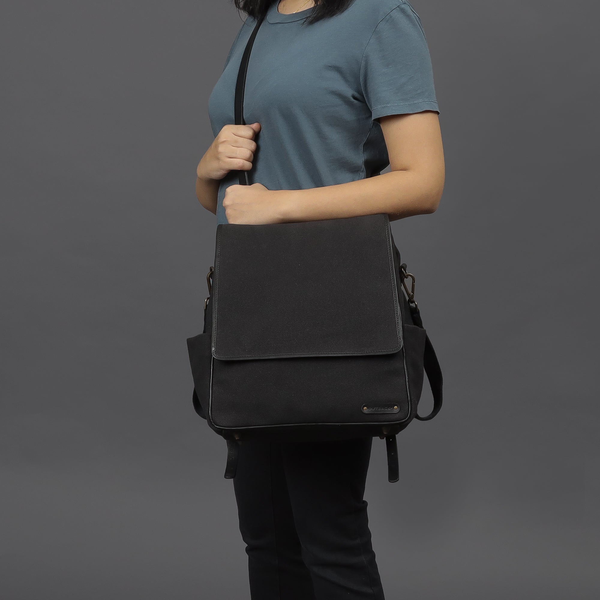 Donna Canvas Diaper Bag in stylish design with multiple pockets and durable materials, perfect for parents on the go.