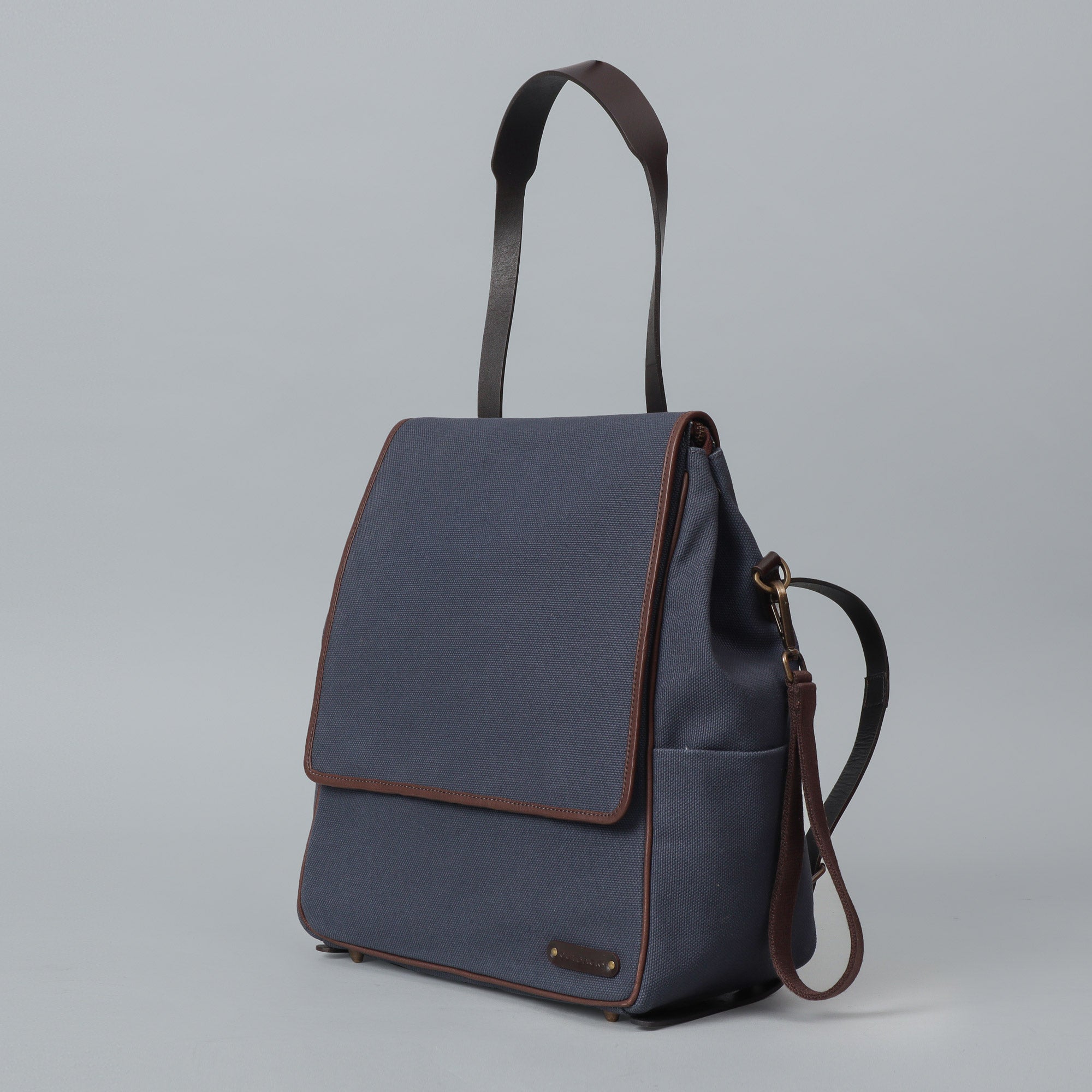 Donna Canvas Diaper Bag in stylish design, featuring multiple pockets and durable materials, perfect for parents.