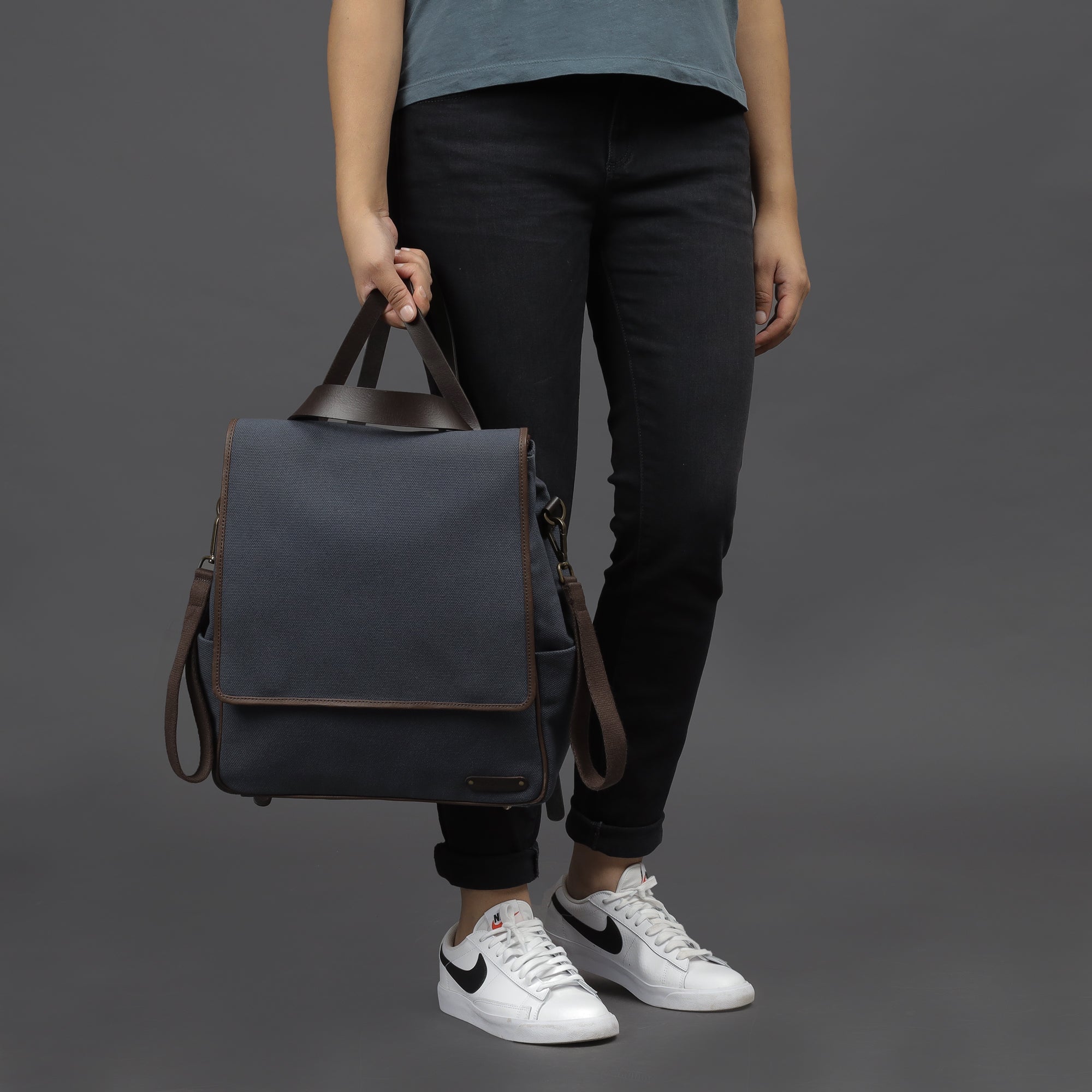 Donna Canvas Diaper Bag in stylish design, featuring multiple pockets and durable materials, perfect for parents.