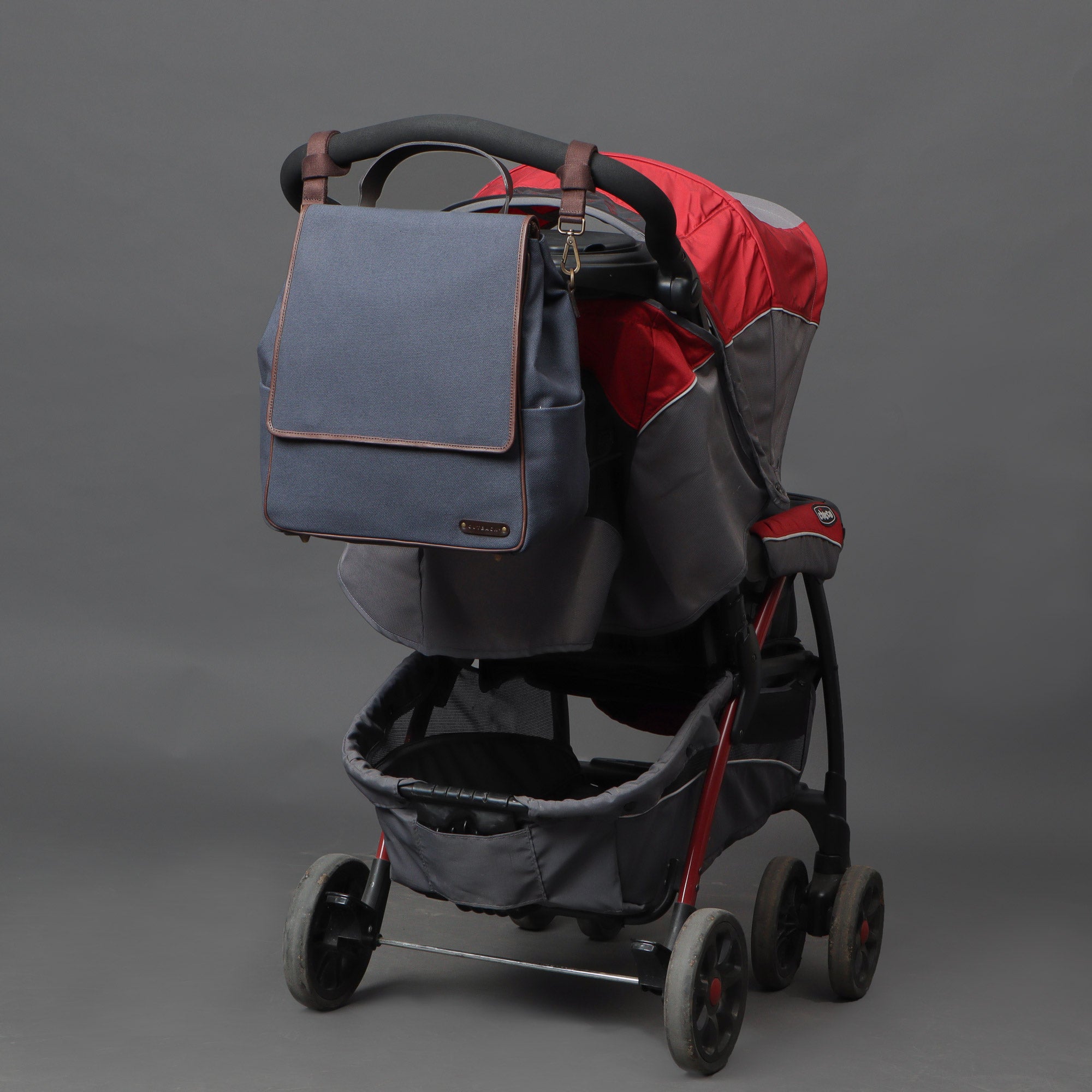 Donna Canvas Diaper Bag in stylish design, featuring multiple pockets and durable materials, perfect for parents.