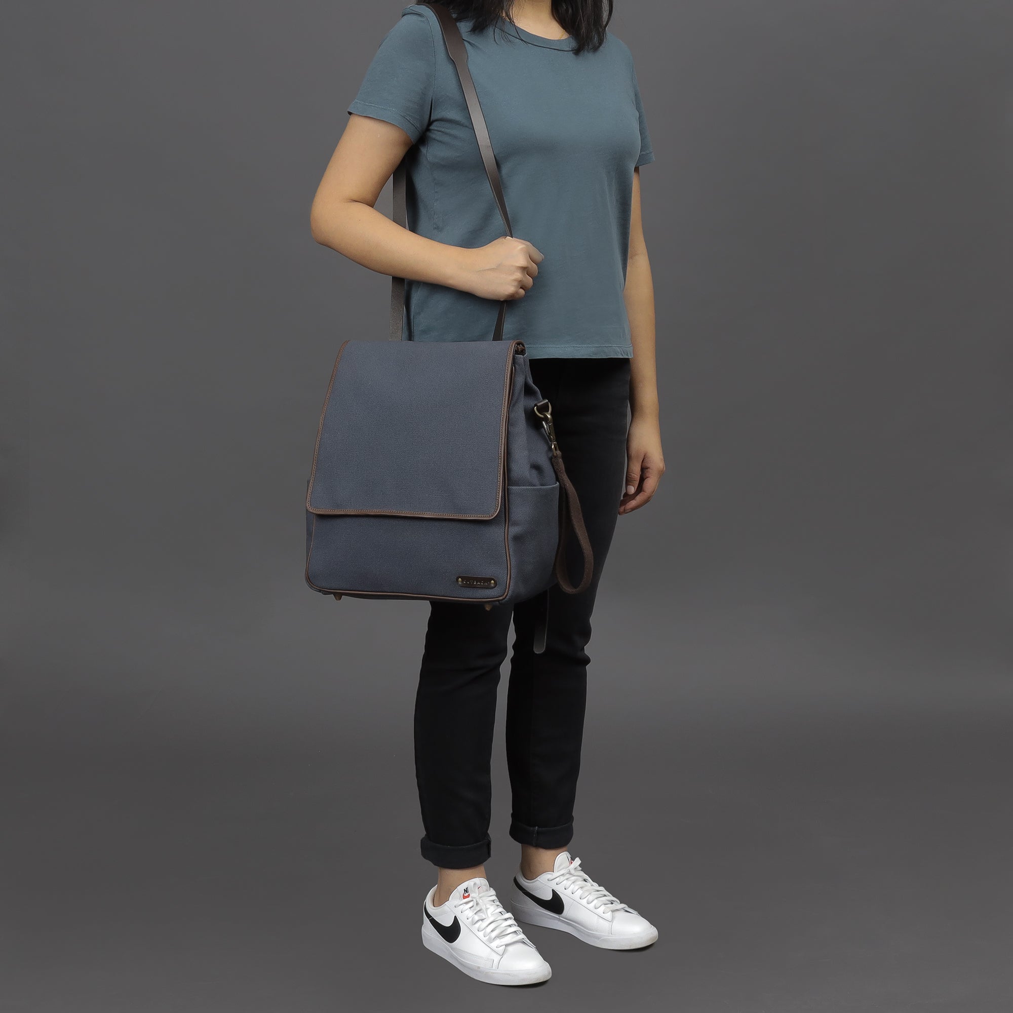 Donna Canvas Diaper Bag in stylish design, featuring multiple pockets and durable materials, perfect for parents.