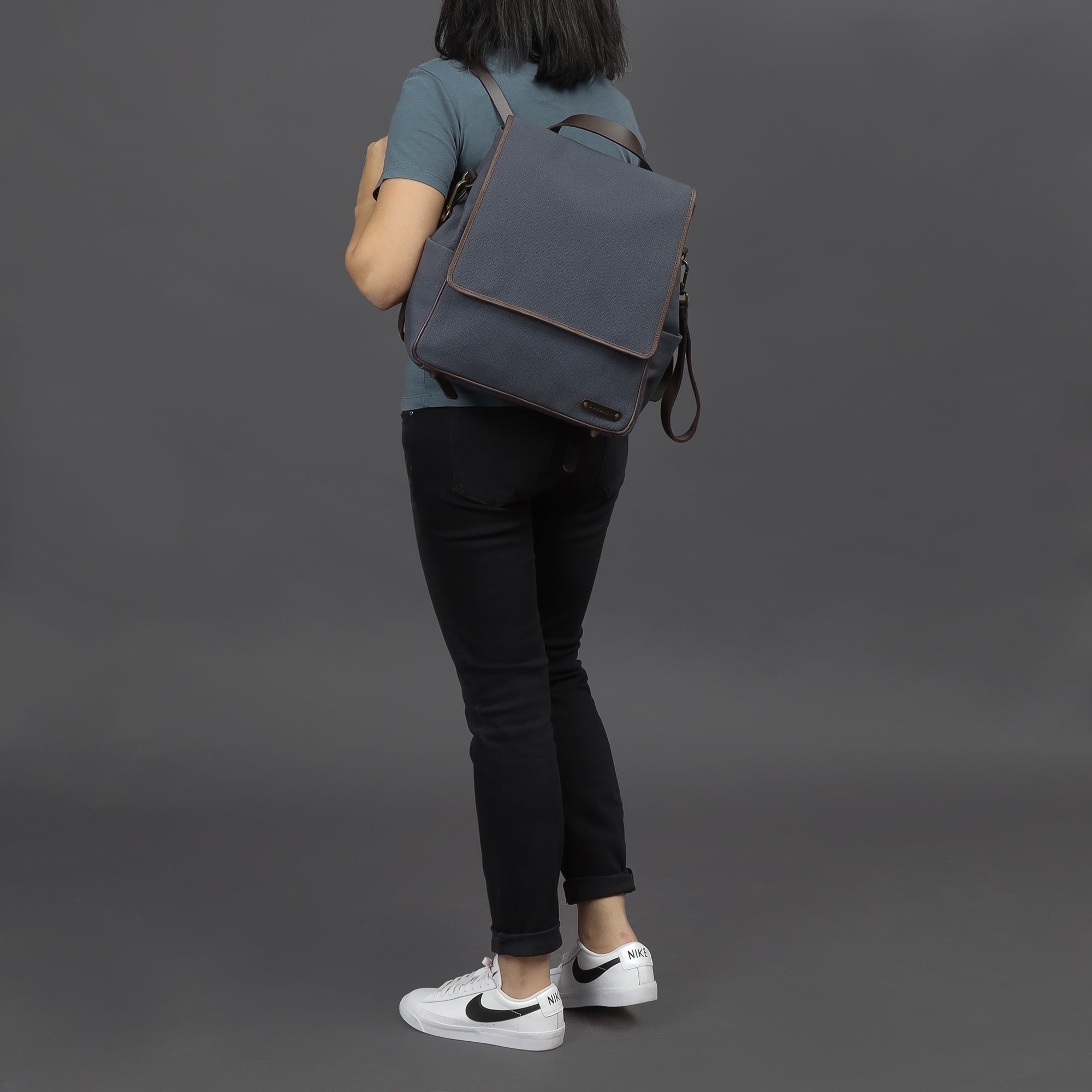 Donna Canvas Diaper Bag in stylish design, featuring multiple pockets and durable materials, perfect for parents.