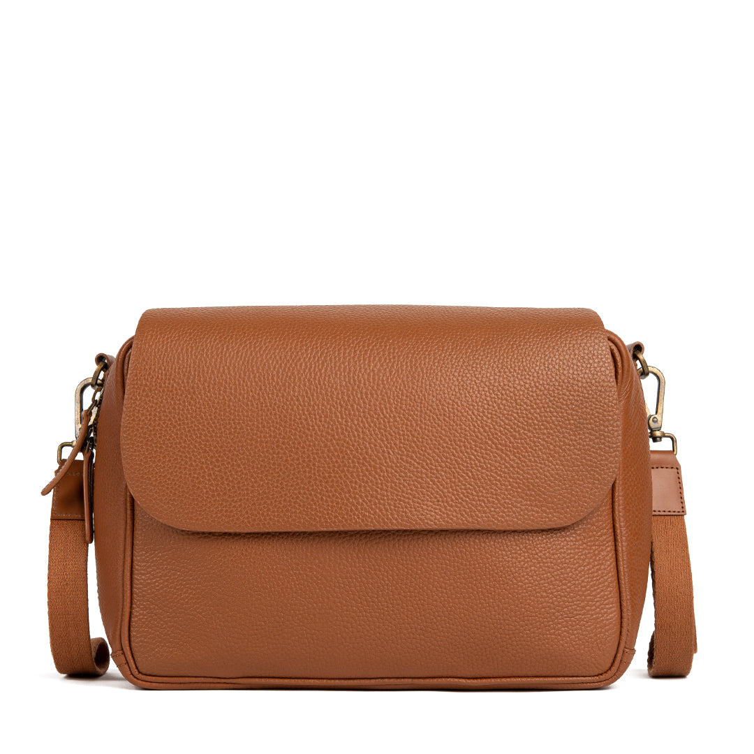 Donna Convertible Diaper Bag in premium leather, showcasing its stylish design and functional features.