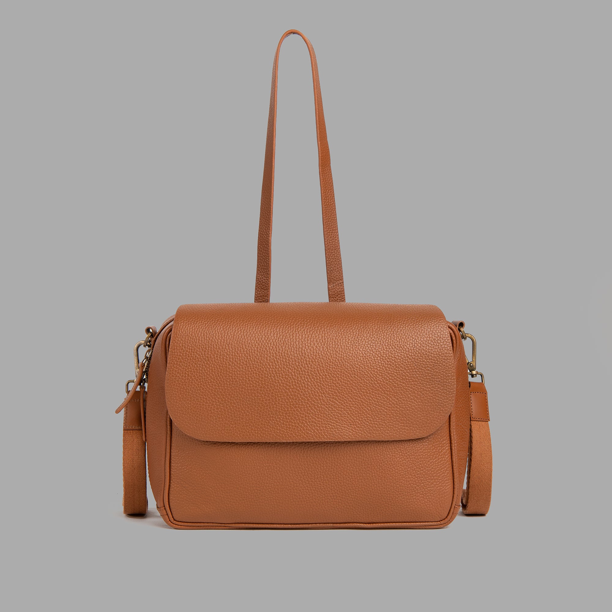 Donna Convertible Diaper Bag in premium leather, showcasing its stylish design and functional features.