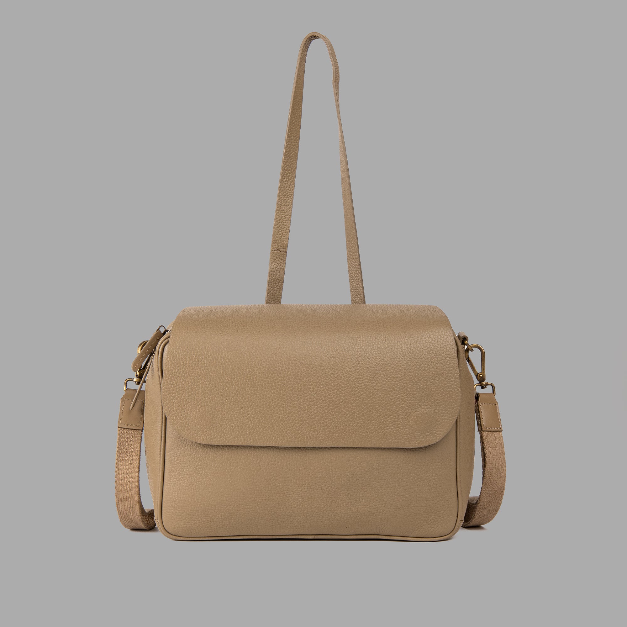 Donna Convertible Diaper Bag in premium leather, featuring a padded iPad section and multiple pockets for organization.