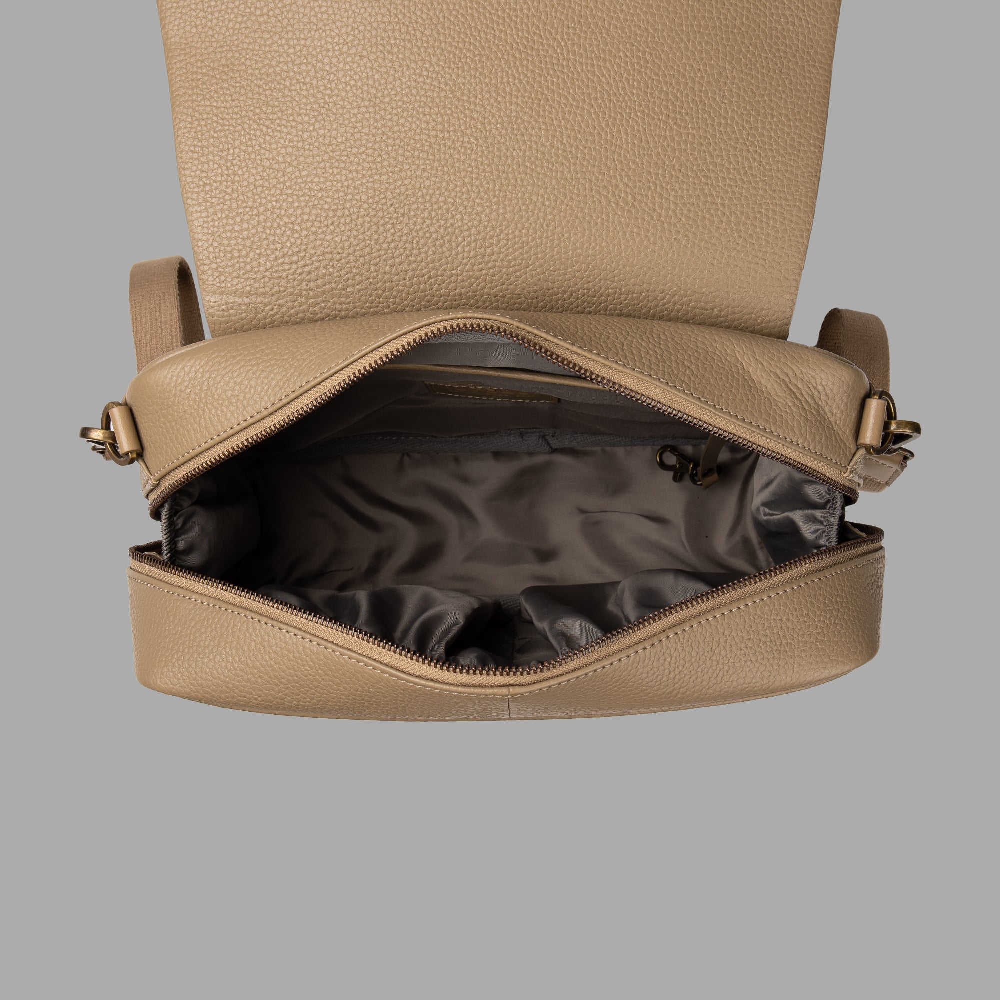 Donna Convertible Diaper Bag in premium leather, featuring a padded iPad section and multiple pockets for organization.