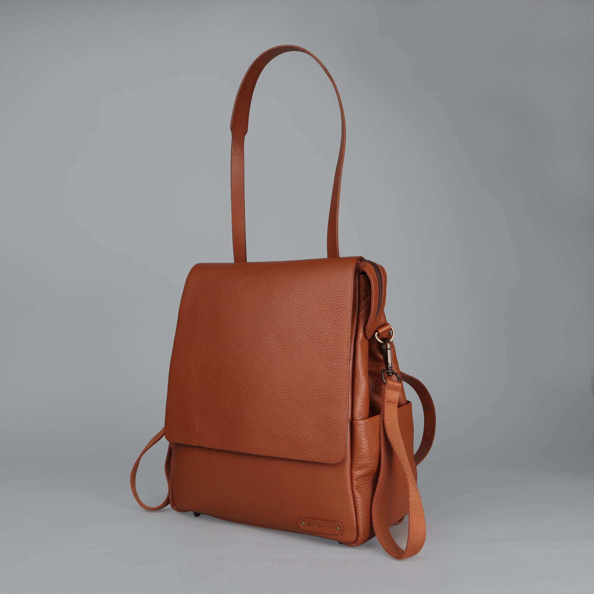 Donna Leather Diaper Bag in premium full grain leather, showcasing its stylish design and multiple pockets.