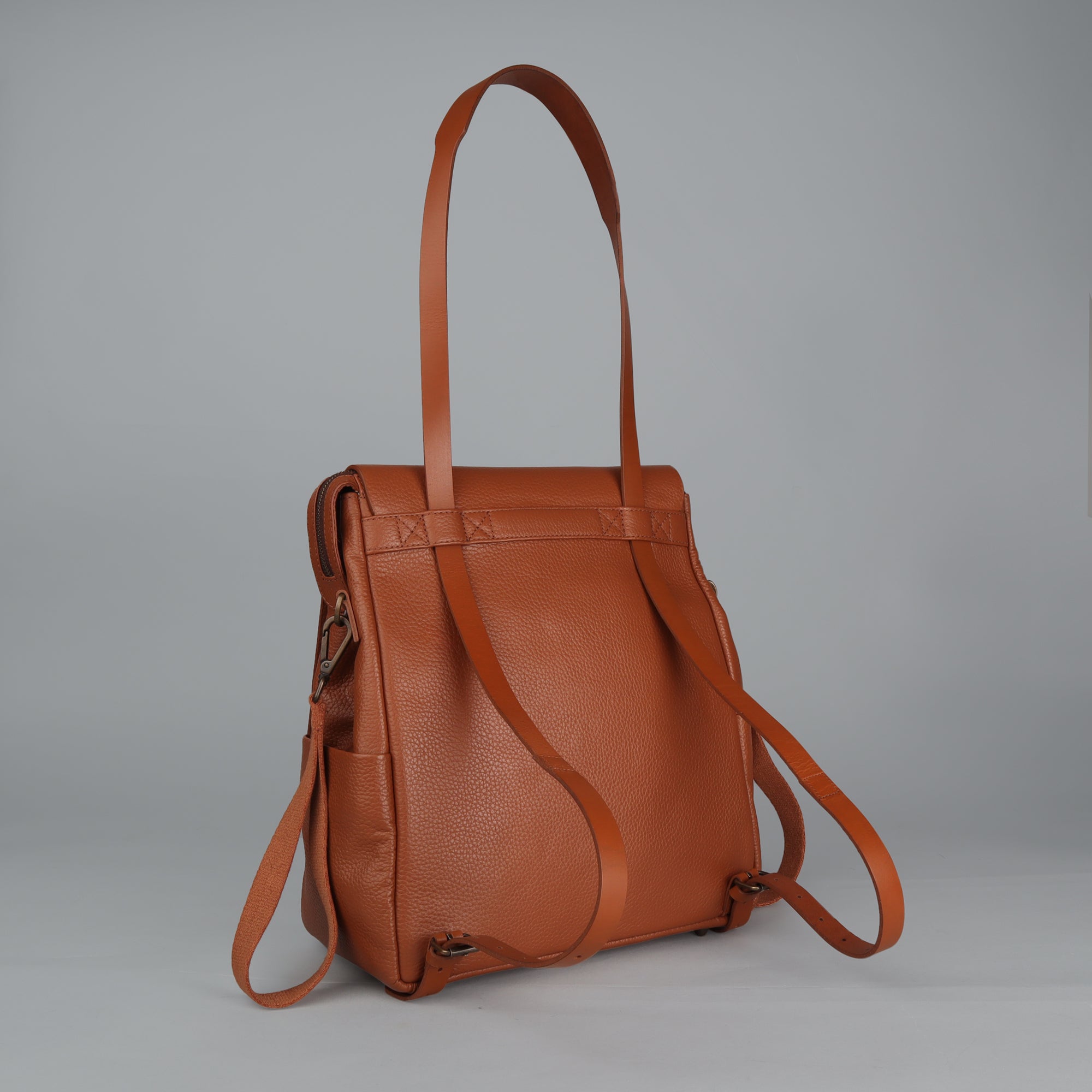 Donna Leather Diaper Bag in premium full grain leather, showcasing its stylish design and multiple pockets.