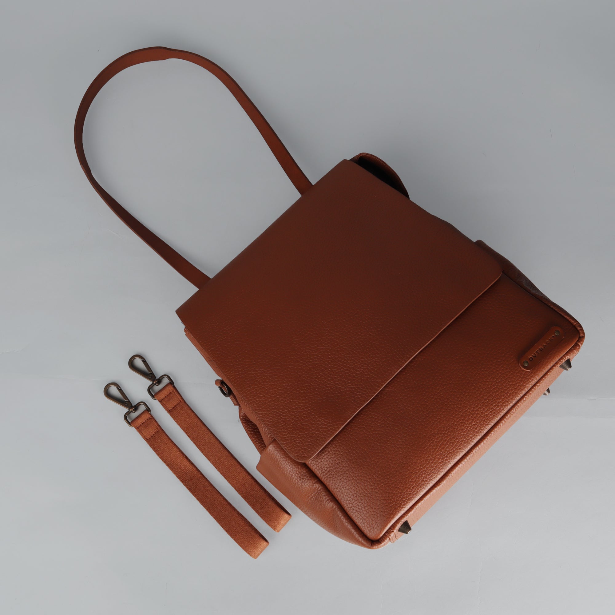 Donna Leather Diaper Bag in premium full grain leather, showcasing its stylish design and multiple pockets.