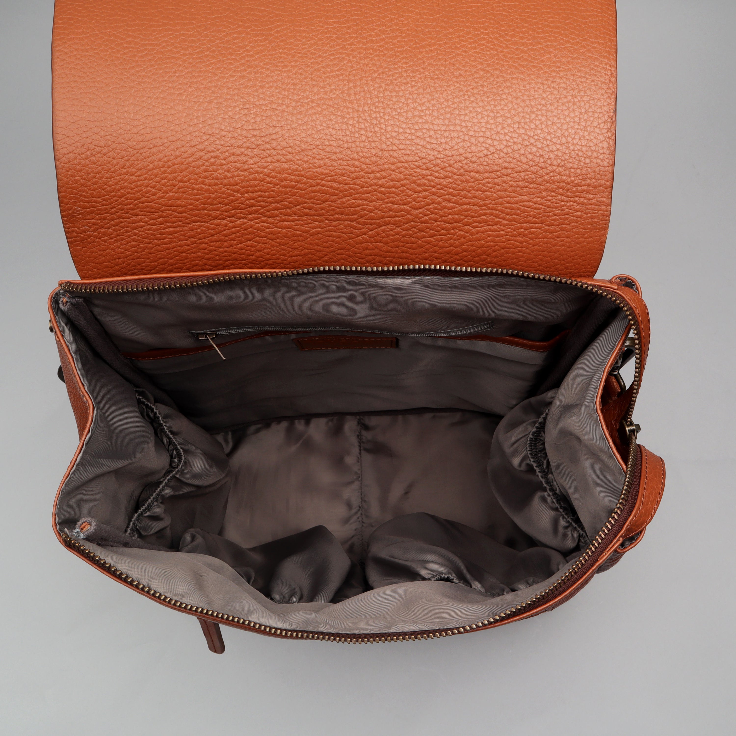 Donna Leather Diaper Bag in premium full grain leather, showcasing its stylish design and multiple pockets.