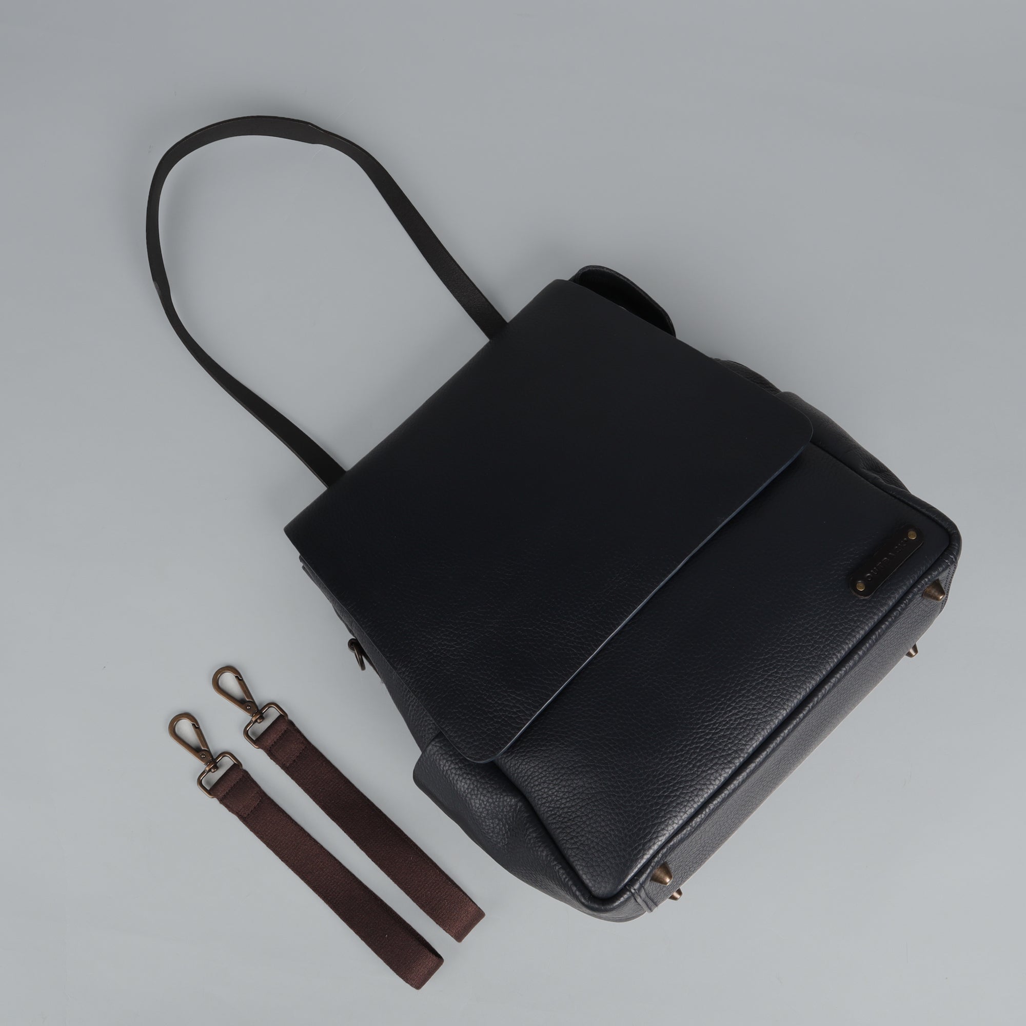 Donna Leather Diaper Bag in premium full grain leather with multiple pockets and stylish design.