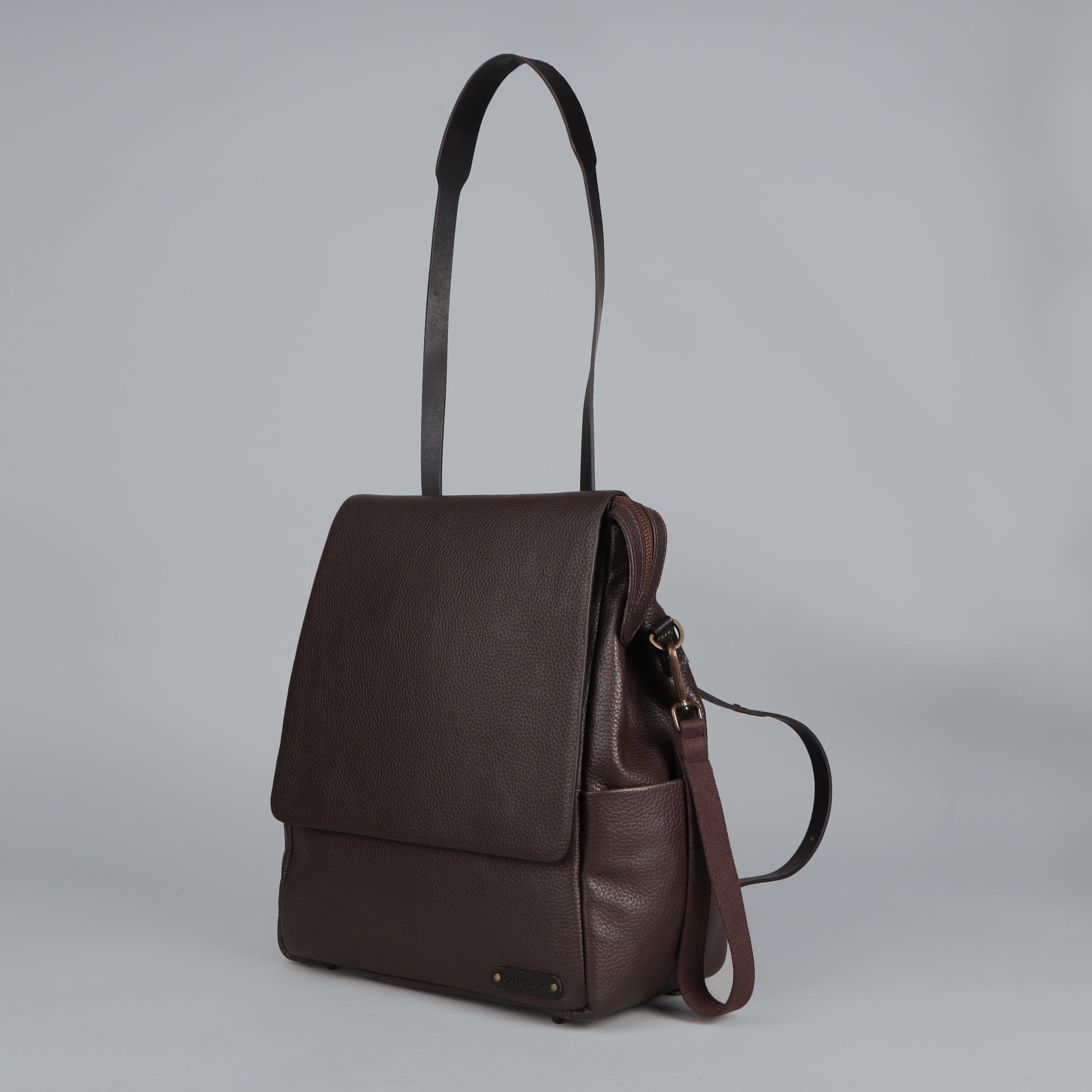 Donna Leather Diaper Bag in premium full grain leather with multiple pockets and versatile carrying options.