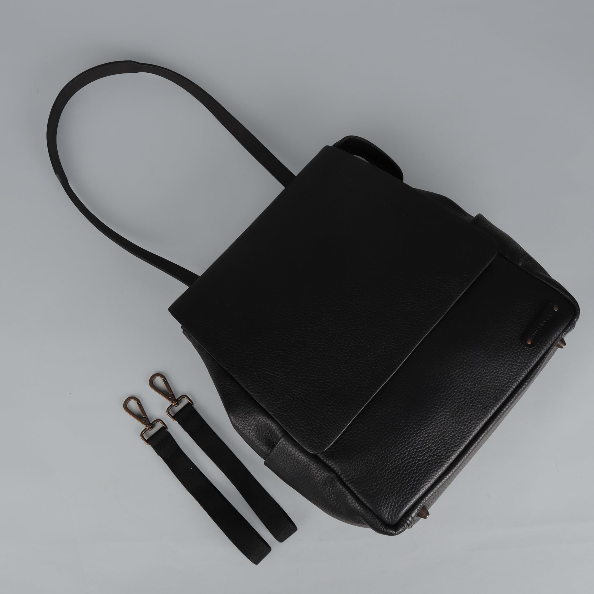 Donna Leather Diaper Bag in premium full grain leather with multiple pockets and versatile carrying options.