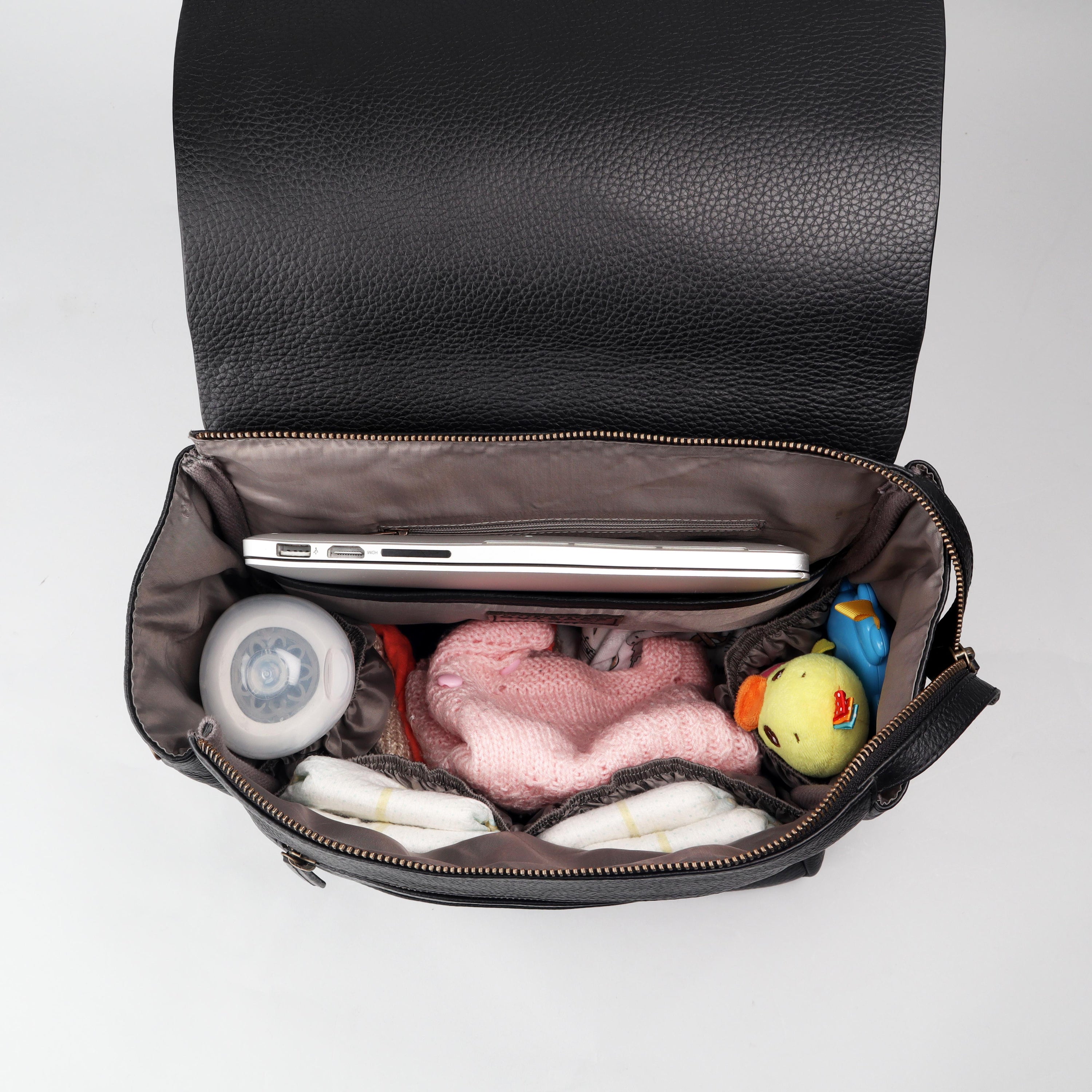 Donna Leather Diaper Bag in premium full grain leather with multiple pockets and versatile carrying options.