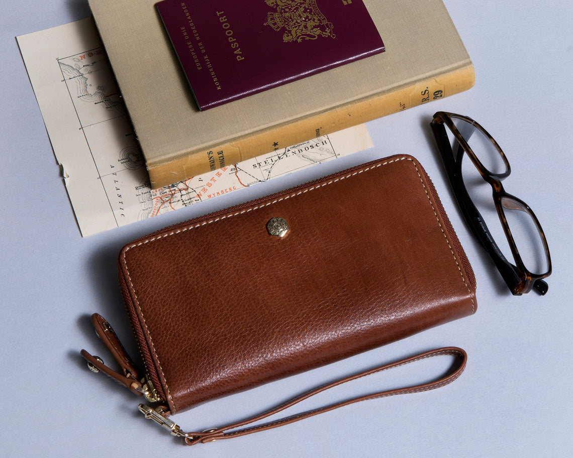 Double Zipper Wristlet Purse in Tan, showcasing its elegant design and double zipper feature.