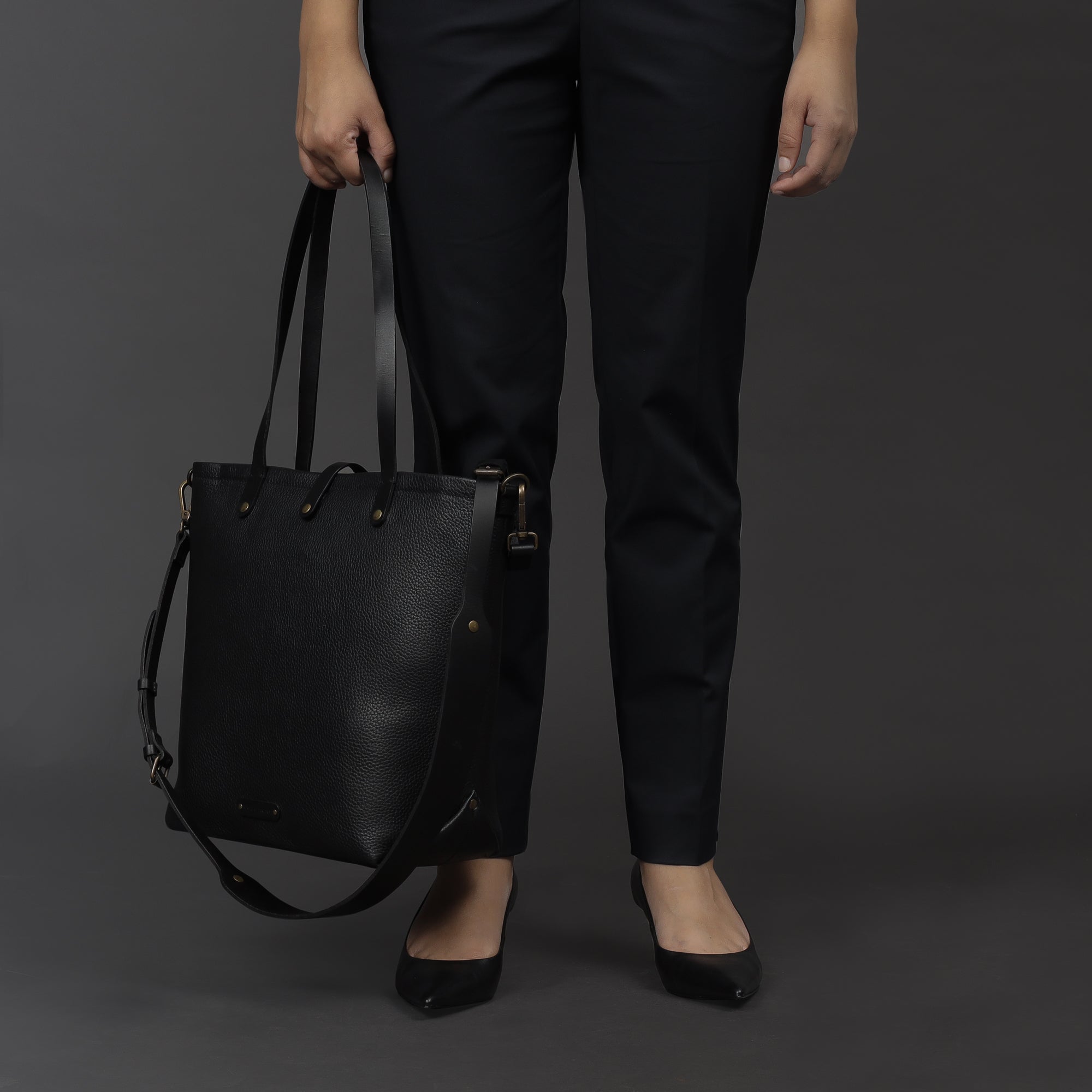 Dublin Leather Tote showcasing premium full grain leather, spacious compartments, and durable straps, perfect for laptops and daily essentials.