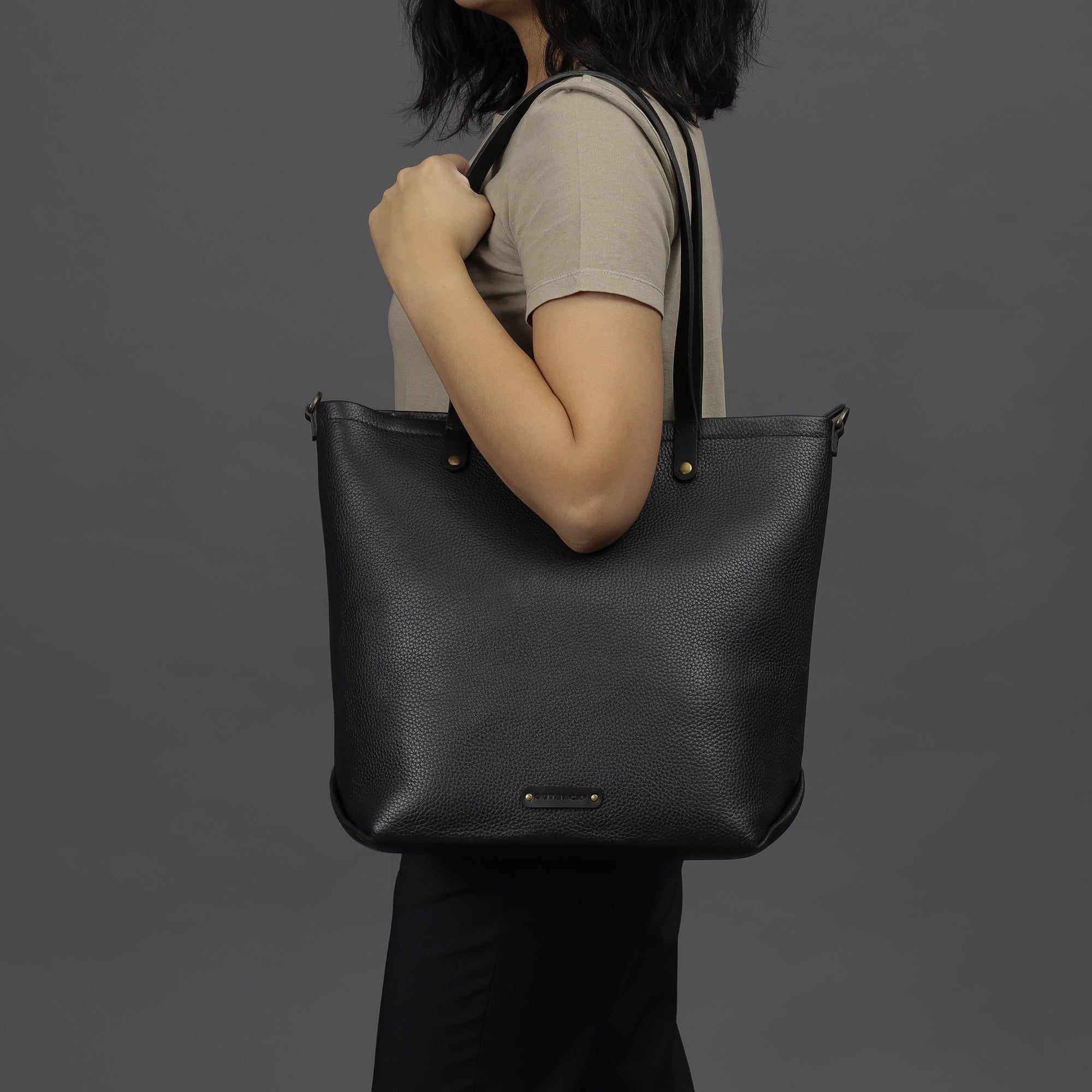 Dublin Leather Tote showcasing premium full grain leather, spacious compartments, and durable straps, perfect for laptops and daily essentials.