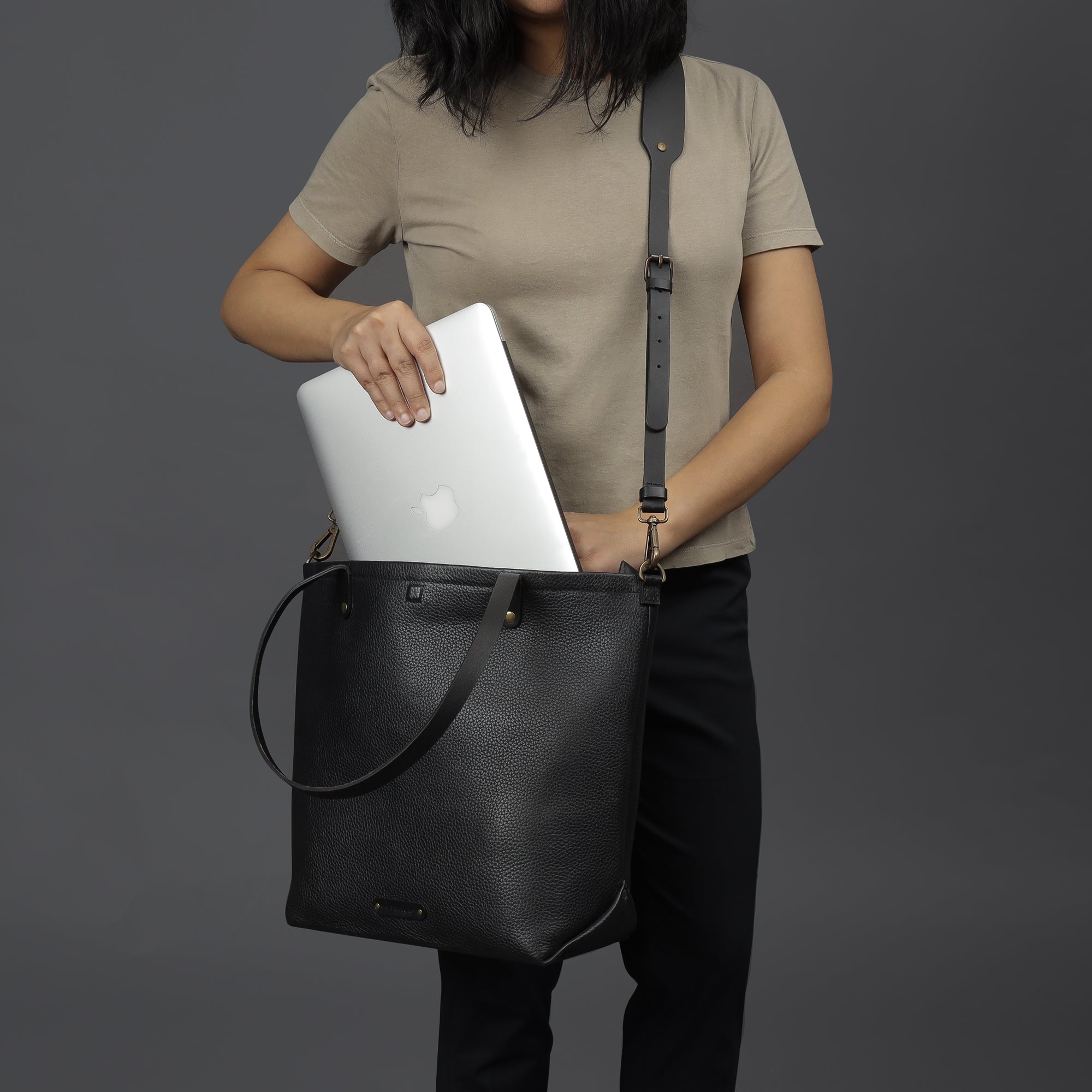 Dublin Leather Tote showcasing premium full grain leather, spacious compartments, and durable straps, perfect for laptops and daily essentials.