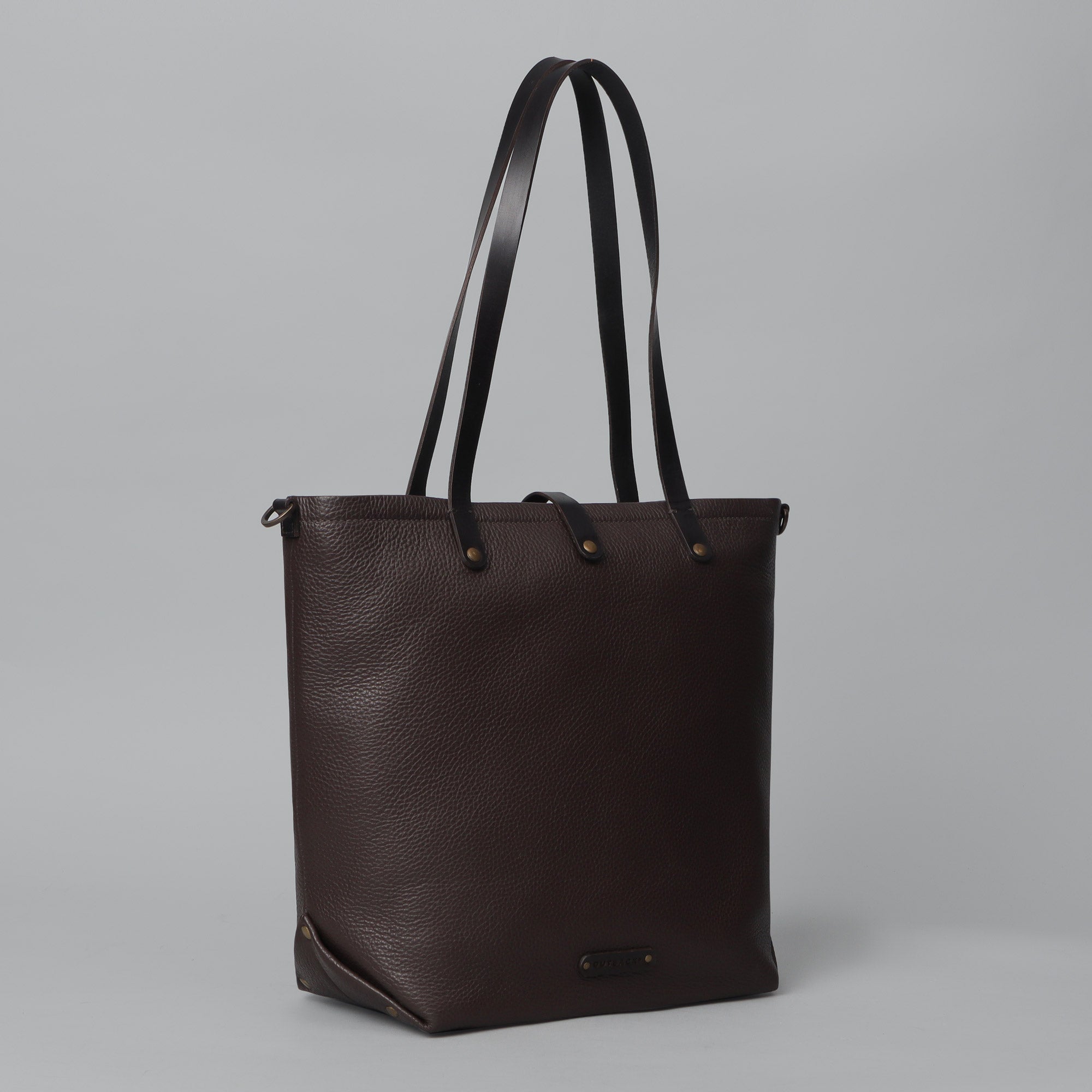 Dublin Leather Tote showcasing premium full grain leather, spacious compartments, and durable straps, perfect for laptops and everyday essentials.