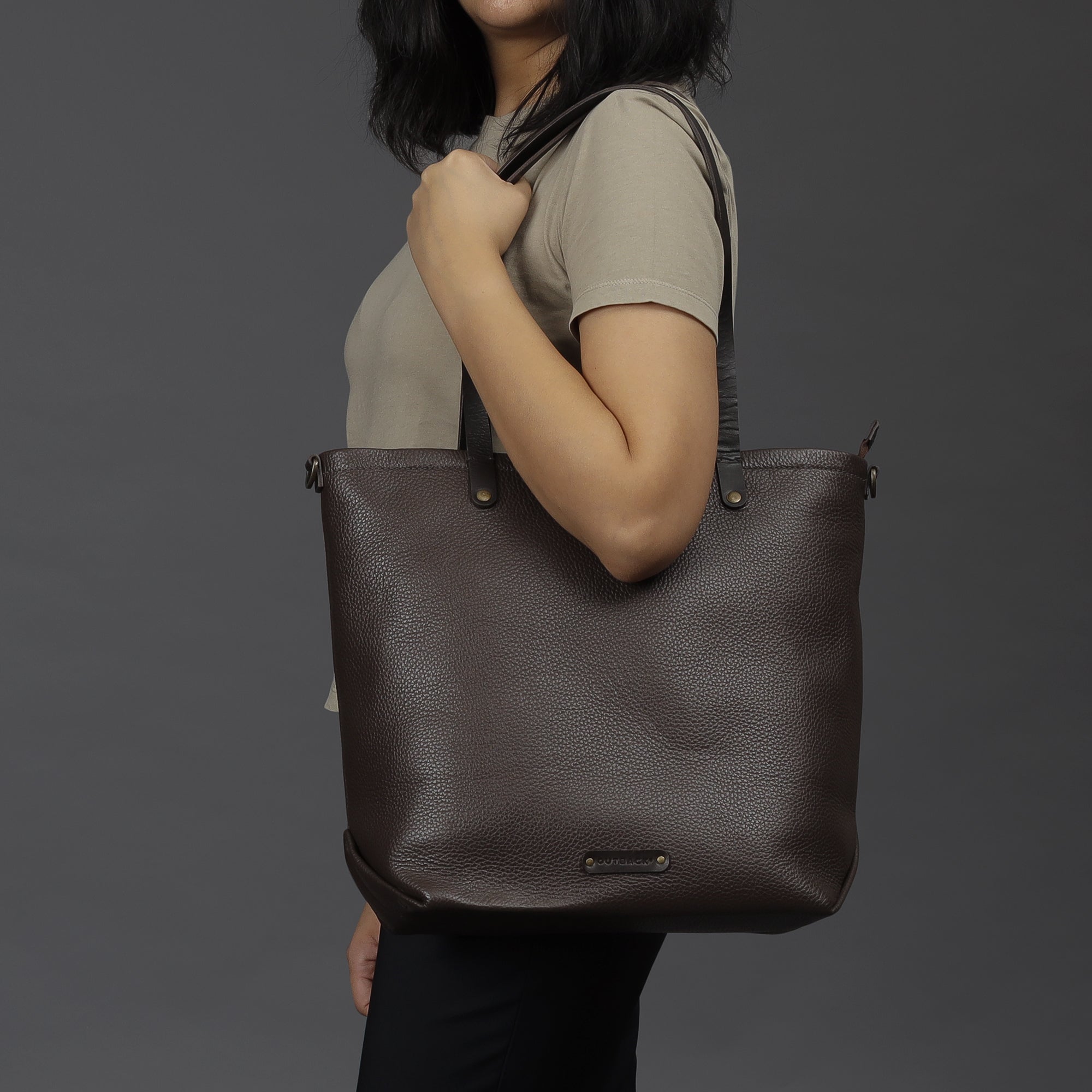 Dublin Leather Tote showcasing premium full grain leather, spacious compartments, and durable straps, perfect for laptops and everyday essentials.