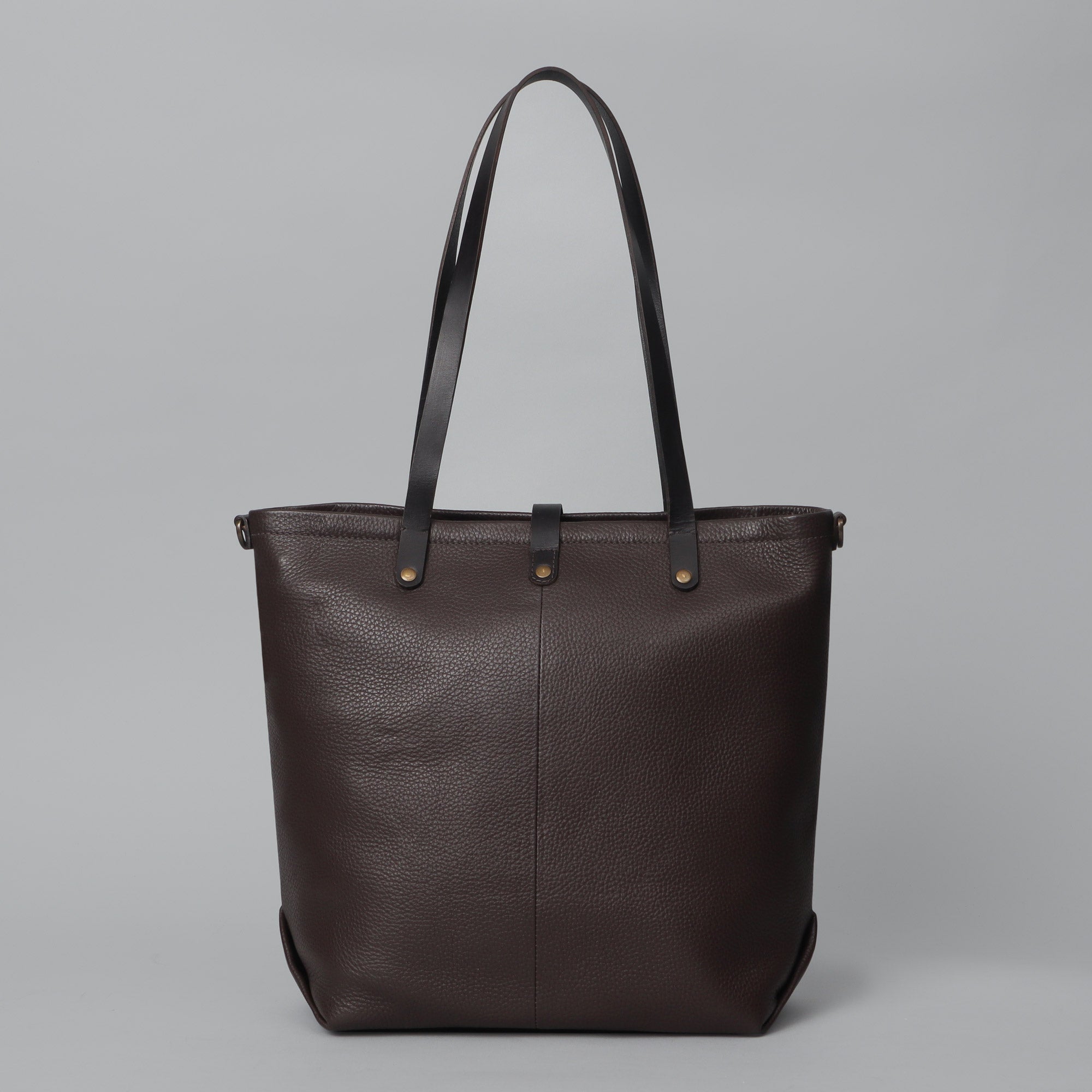 Dublin Leather Tote showcasing premium full grain leather, spacious compartments, and durable straps, perfect for laptops and everyday essentials.