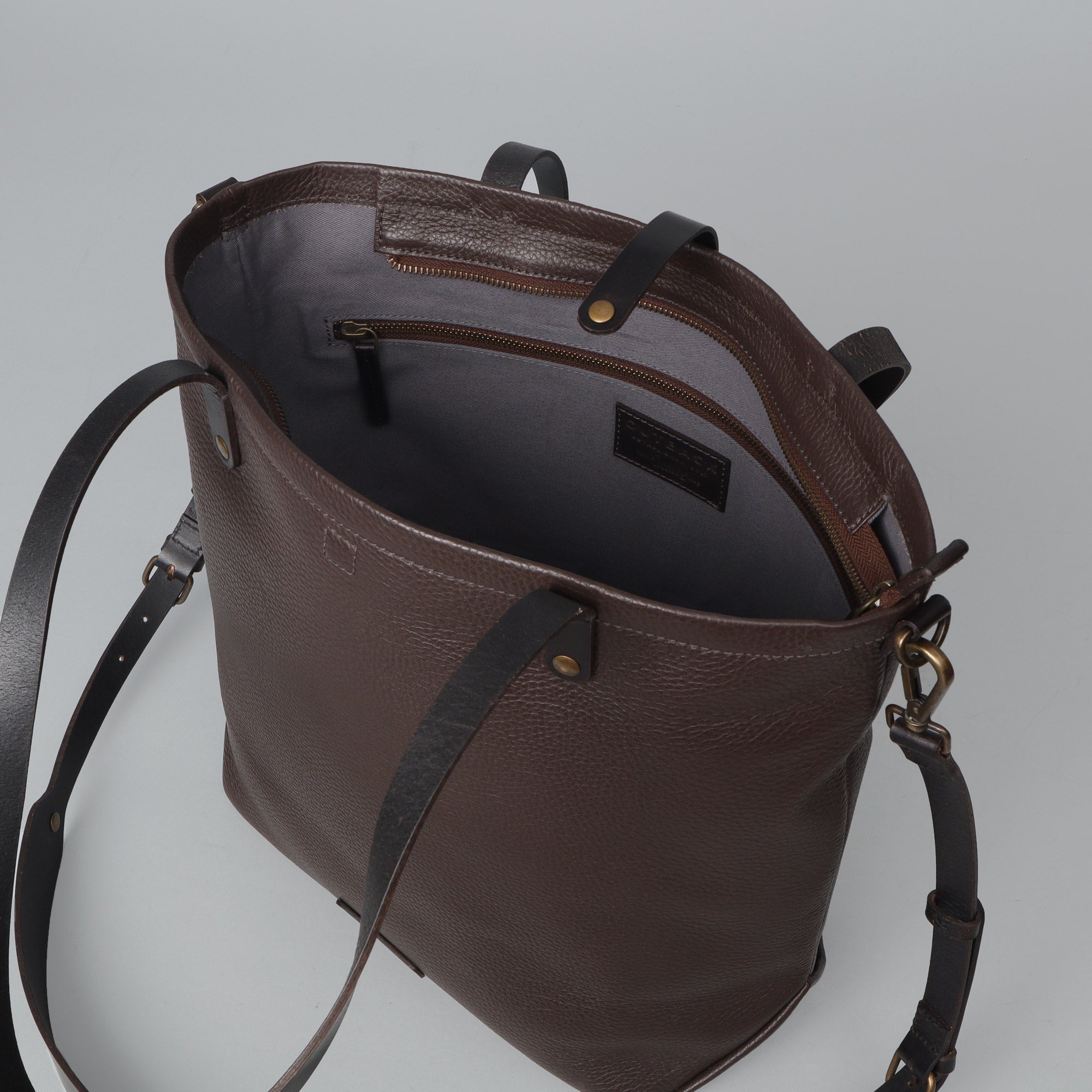 Dublin Leather Tote showcasing premium full grain leather, spacious compartments, and durable straps, perfect for laptops and everyday essentials.