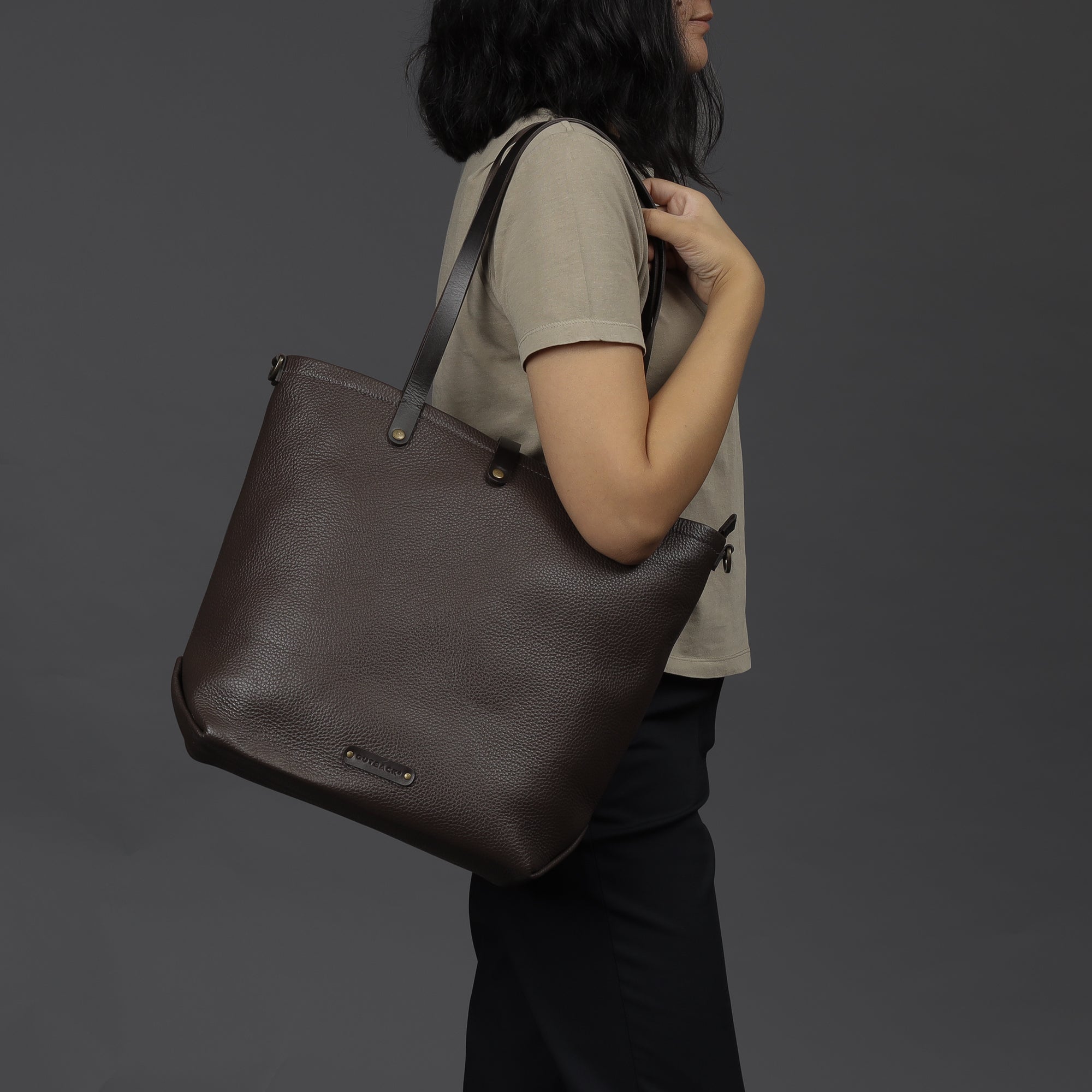 Dublin Leather Tote showcasing premium full grain leather, spacious compartments, and durable straps, perfect for laptops and everyday essentials.