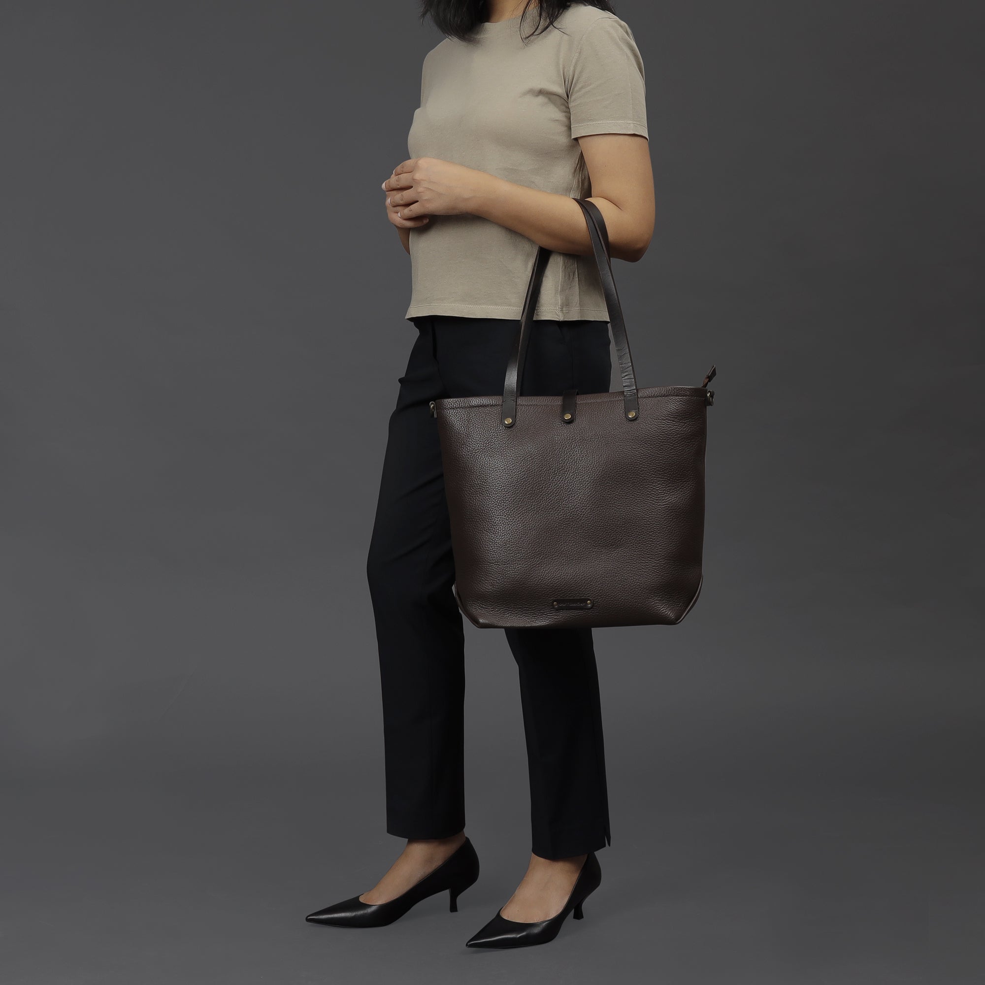 Dublin Leather Tote showcasing premium full grain leather, spacious compartments, and durable straps, perfect for laptops and everyday essentials.