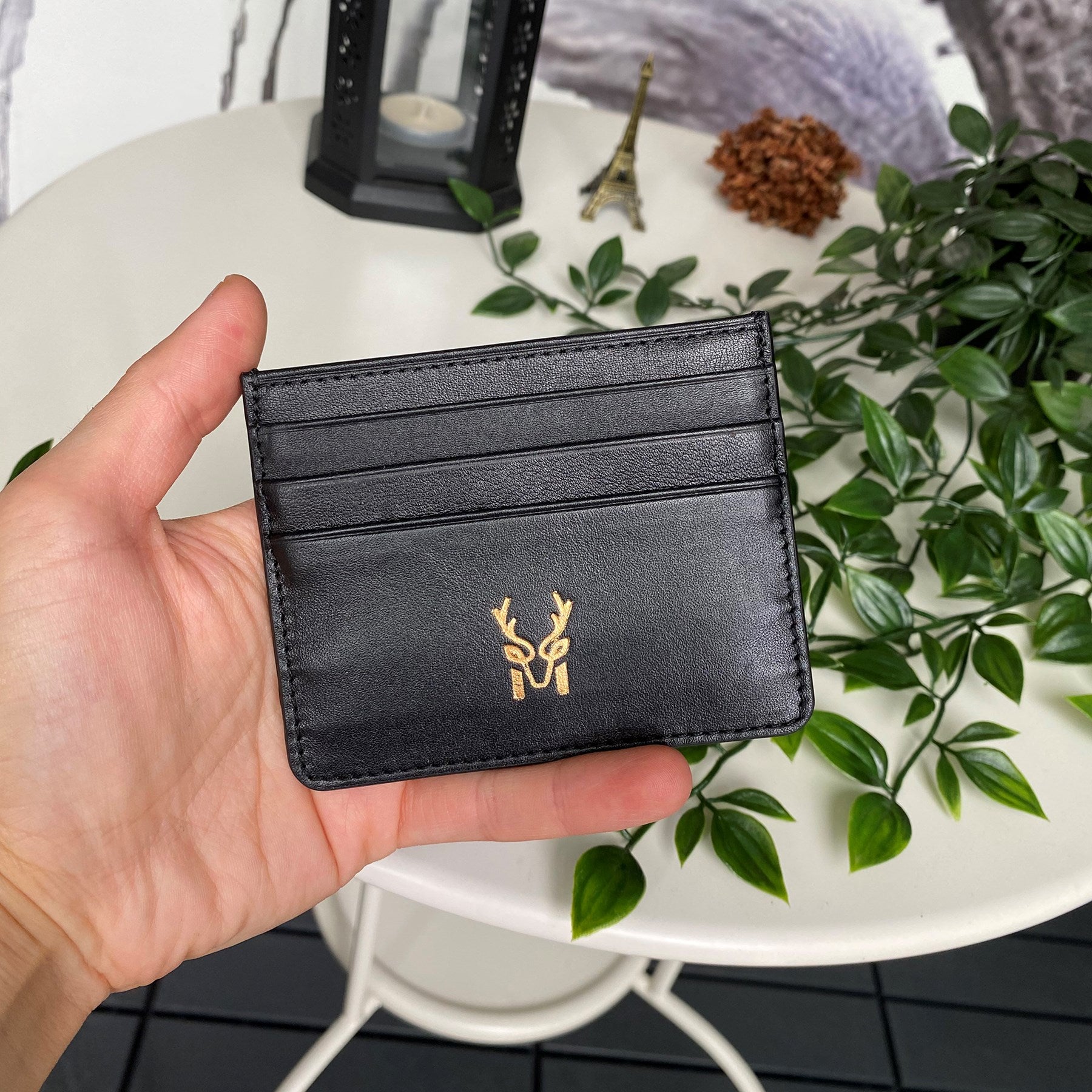 Ducal Genuine Leather Ultra Slim Card Holder in black, showcasing its sleek design and card slots.