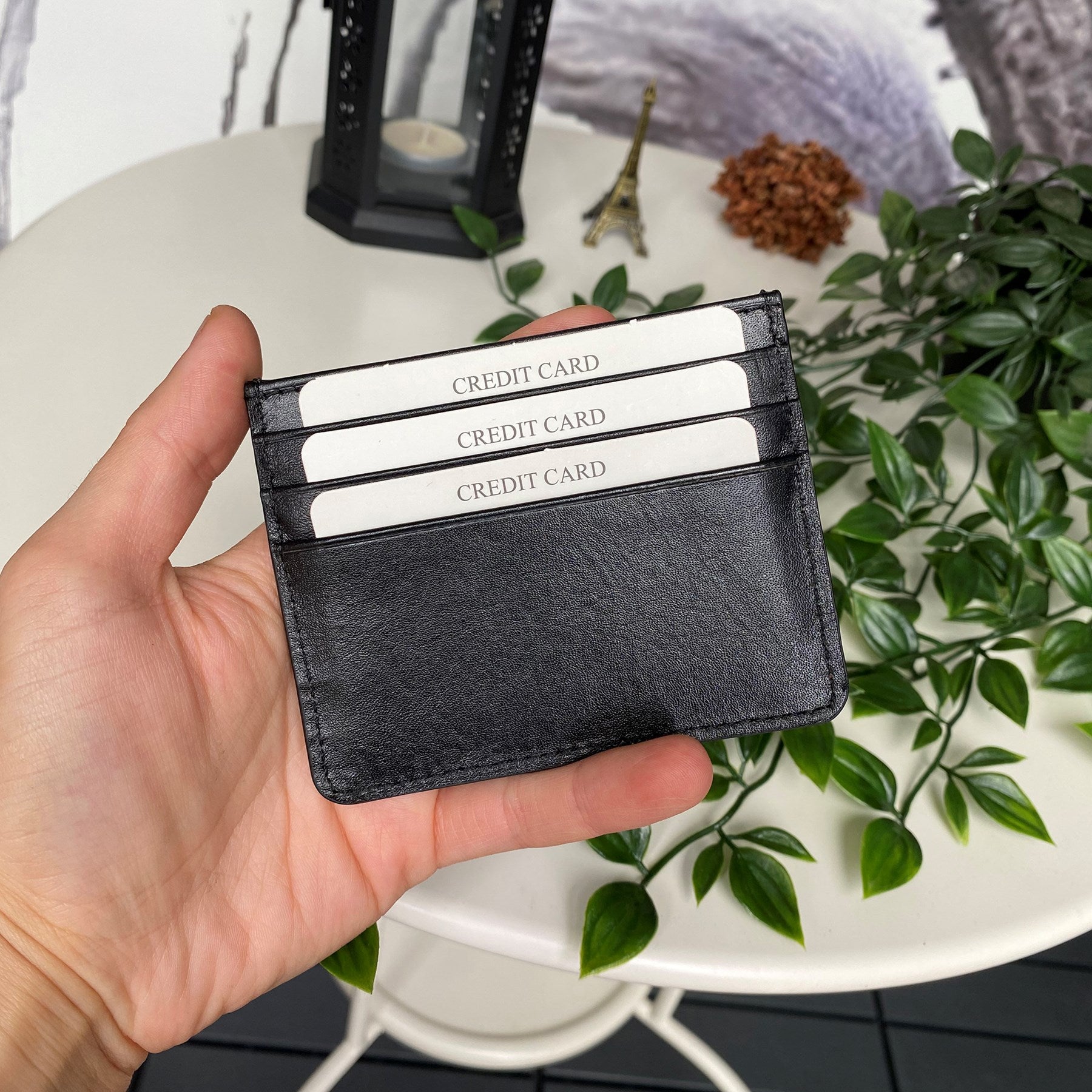 Ducal Genuine Leather Ultra Slim Card Holder in black, showcasing its sleek design and card slots.