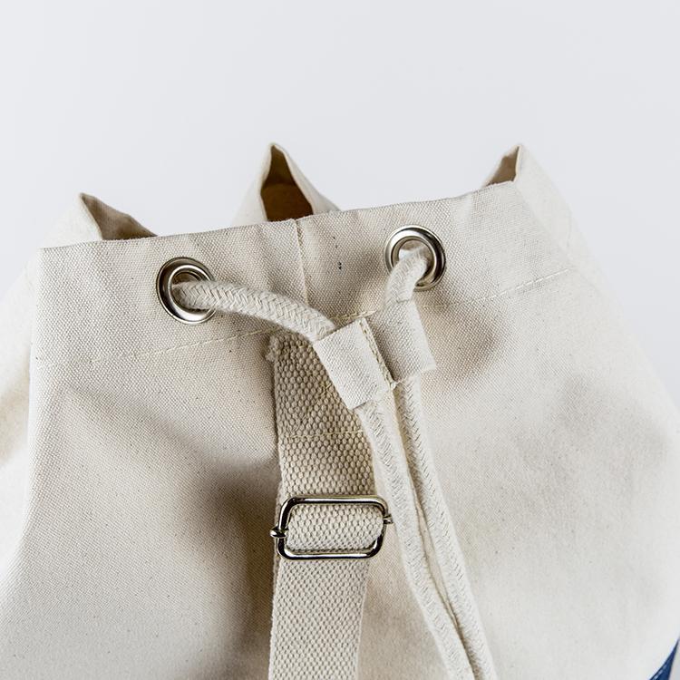 Dunes Drawstring Duffel bag in classic canvas with heavy rope closure and adjustable shoulder strap.