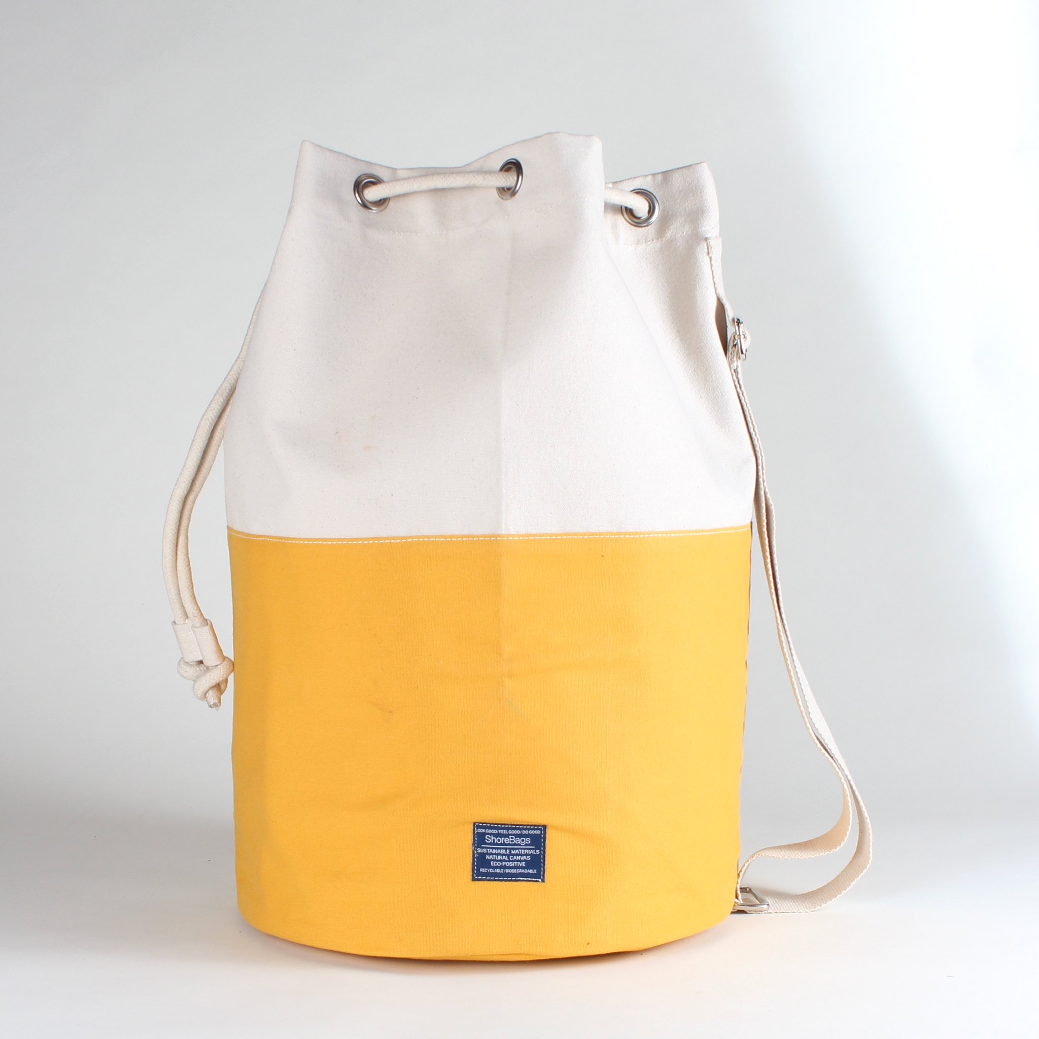 Dunes Drawstring Duffel bag in classic canvas with heavy rope closure and adjustable shoulder strap.