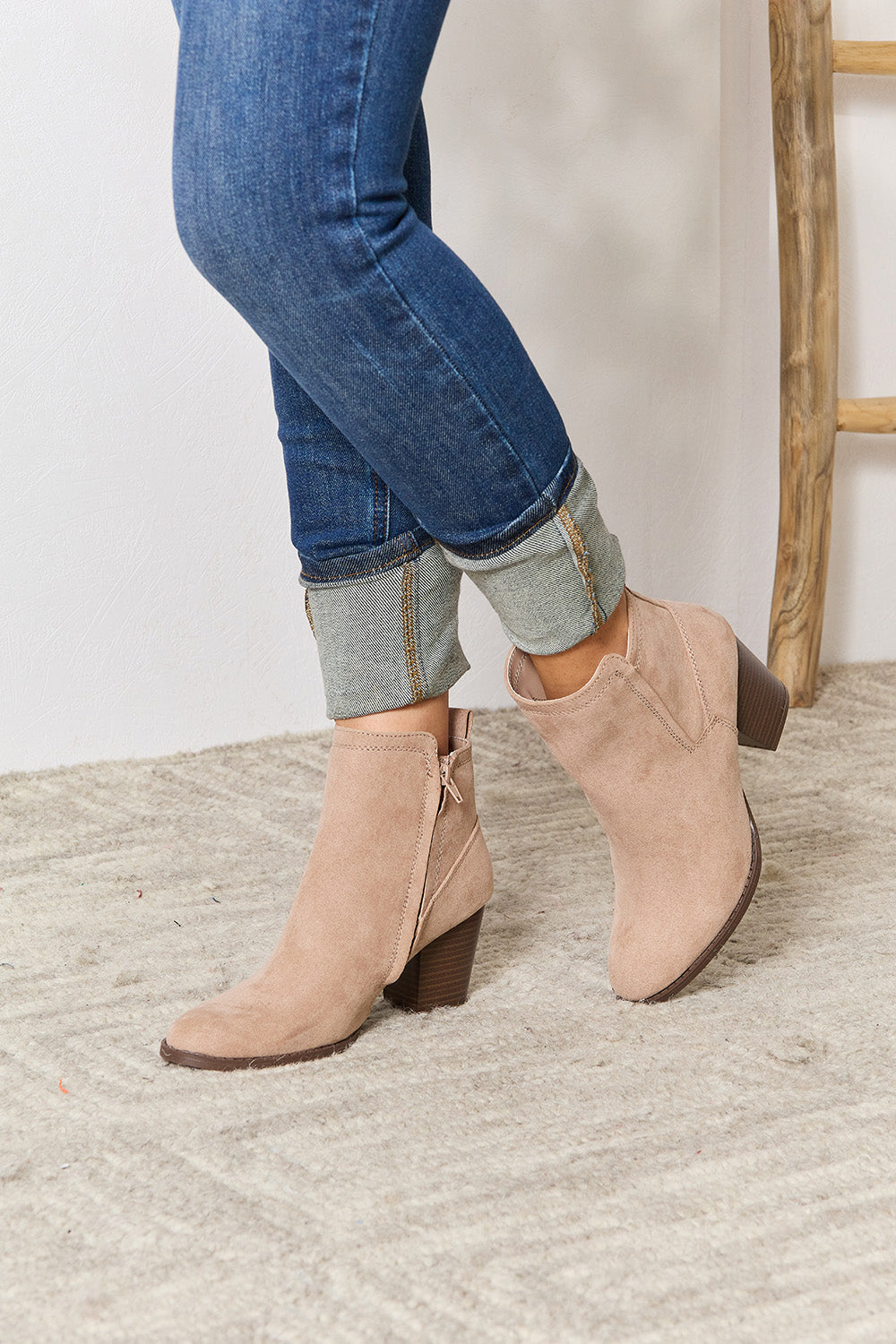 East Lion Corp Block Heel Point Toe Ankle Boots featuring a stylish pointed toe and comfortable block heel, made from faux suede.