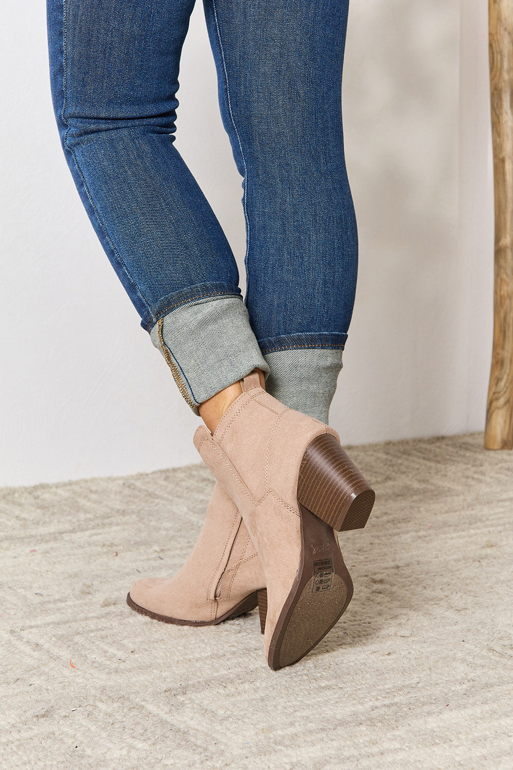 East Lion Corp Block Heel Point Toe Ankle Boots featuring a stylish pointed toe and comfortable block heel, made from faux suede.